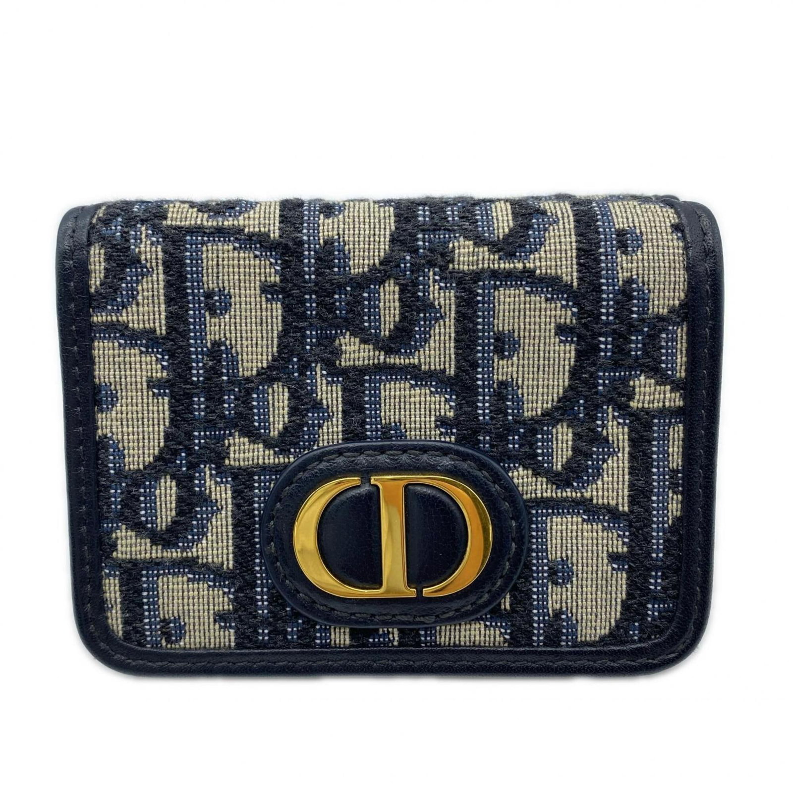 Canvas Tri-Fold Christian Dior Wallet: Canvas Tri-Fold Christian Dior Wallet Canvas Tri-Fold Christian Dior Wallet. This tri-fold wallet features a canvas material in a stylish gray and navy color combination, measuring 7cm x 9.5cm x 3cm. 