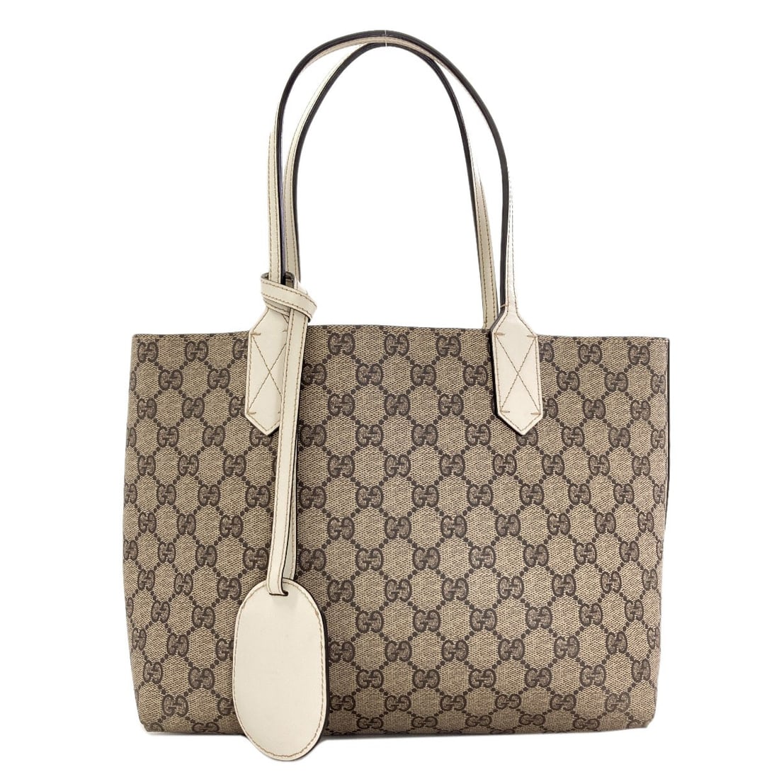 Gucci 372513 Gg Supreme Reversible Tote Bag Pvc: Gucci 372513 Gg Supreme Reversible Tote Bag Pvc This Gucci 372513 Gg Supreme Reversible Tote Bag is made from durable PVC, featuring a reversible design that adds versatility to its classic style. Wit