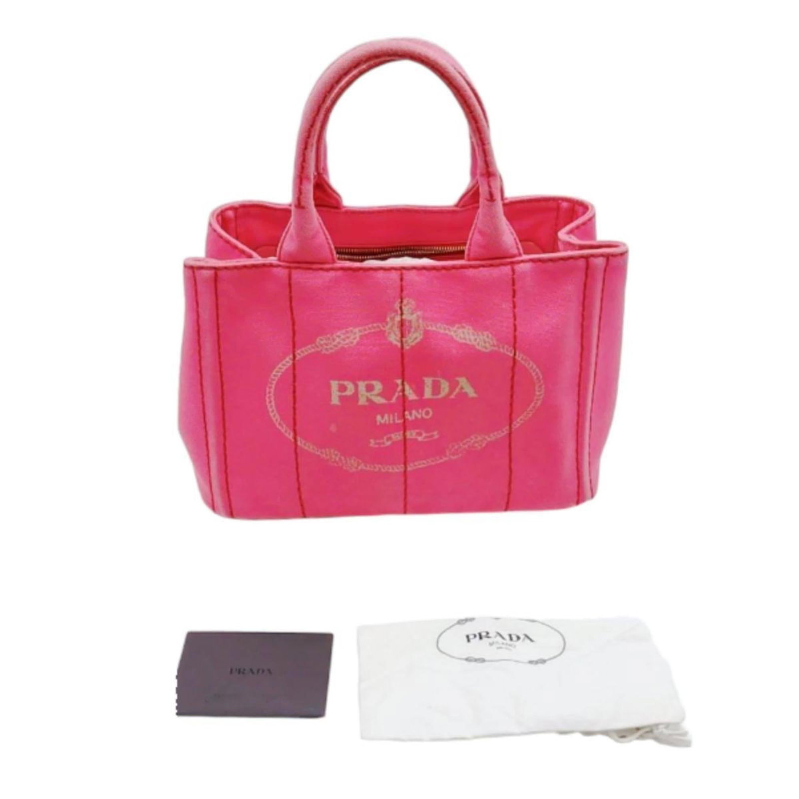 Canvas Prada Tote: Canvas Prada Tote Canvas Prada Tote in Pink, 19cm x 28cm x 16cm, with Guarantee card and Shoulder strap. This canvas tote bag from Prada features a vibrant pink color and is made from high-quality