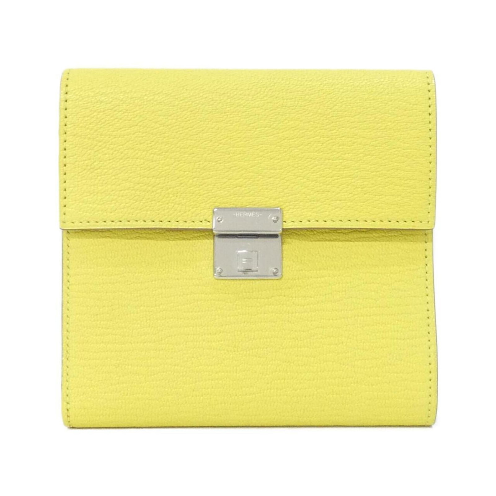 Chevre Leather Tri-Fold Wallet Hermes: Chevre Leather Tri-Fold Wallet Hermes Chevre leather provides a unique texture and look to this tri-fold wallet, while its lime color adds a pop of personality. Made from high-quality chevre leather,