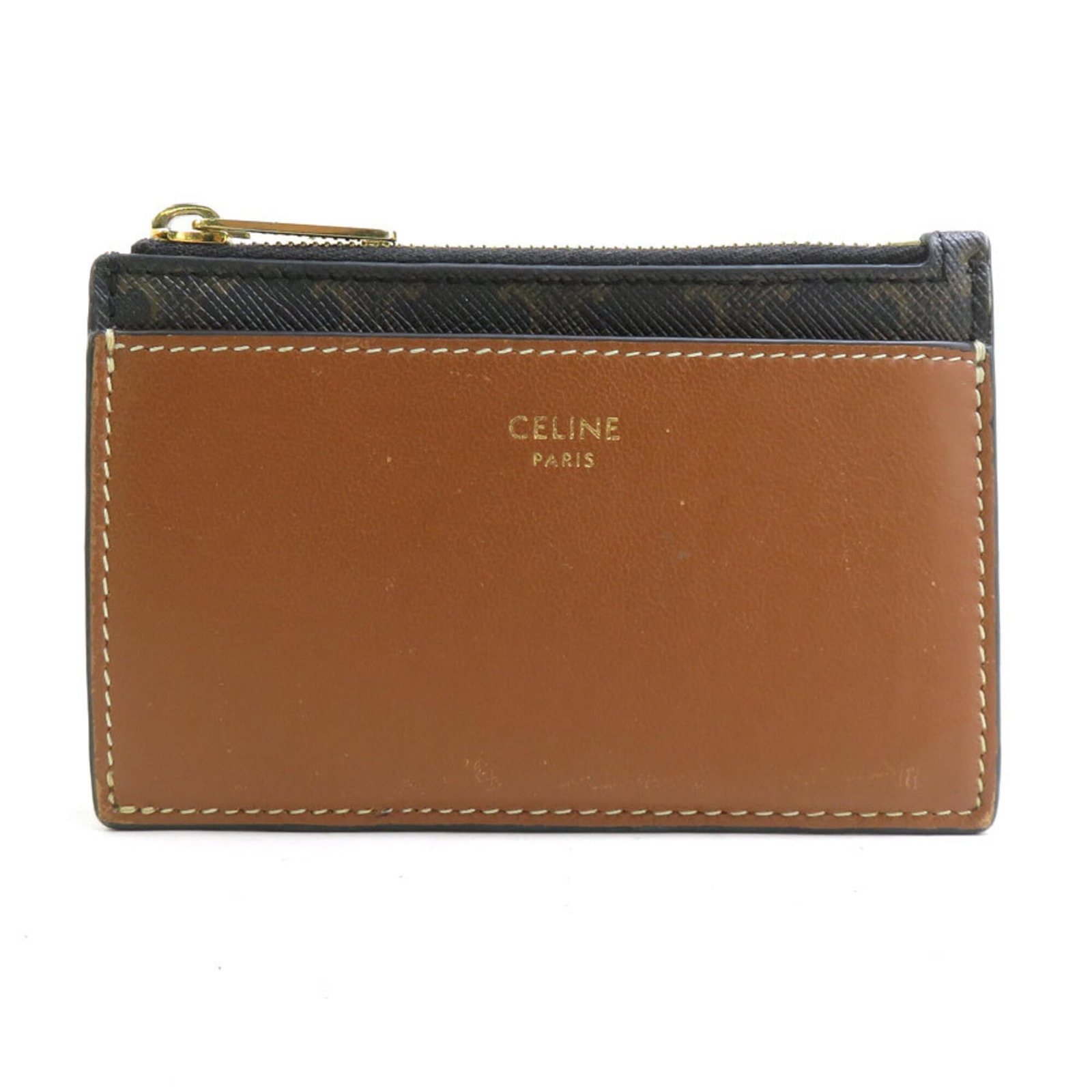 Celine Coin Purse/ Coin Case Coated Canvas Leather: Celine Coin Purse/ Coin Case Coated Canvas Leather Coated canvas and leather blend creates a unique texture in this Celine coin purse. The brown color and compact size make it a practical and stylish