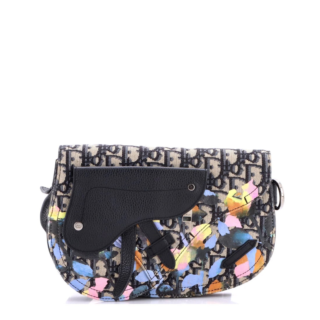 Christian Dior Saddle Messenger Pouch Canvas Oblique Floral: Christian Dior Saddle Messenger Pouch Canvas Oblique Floral Black canvas messenger pouch with a multicolor oblique floral design, featuring a silver buckle and adjustable strap. The Saddle Messenger P