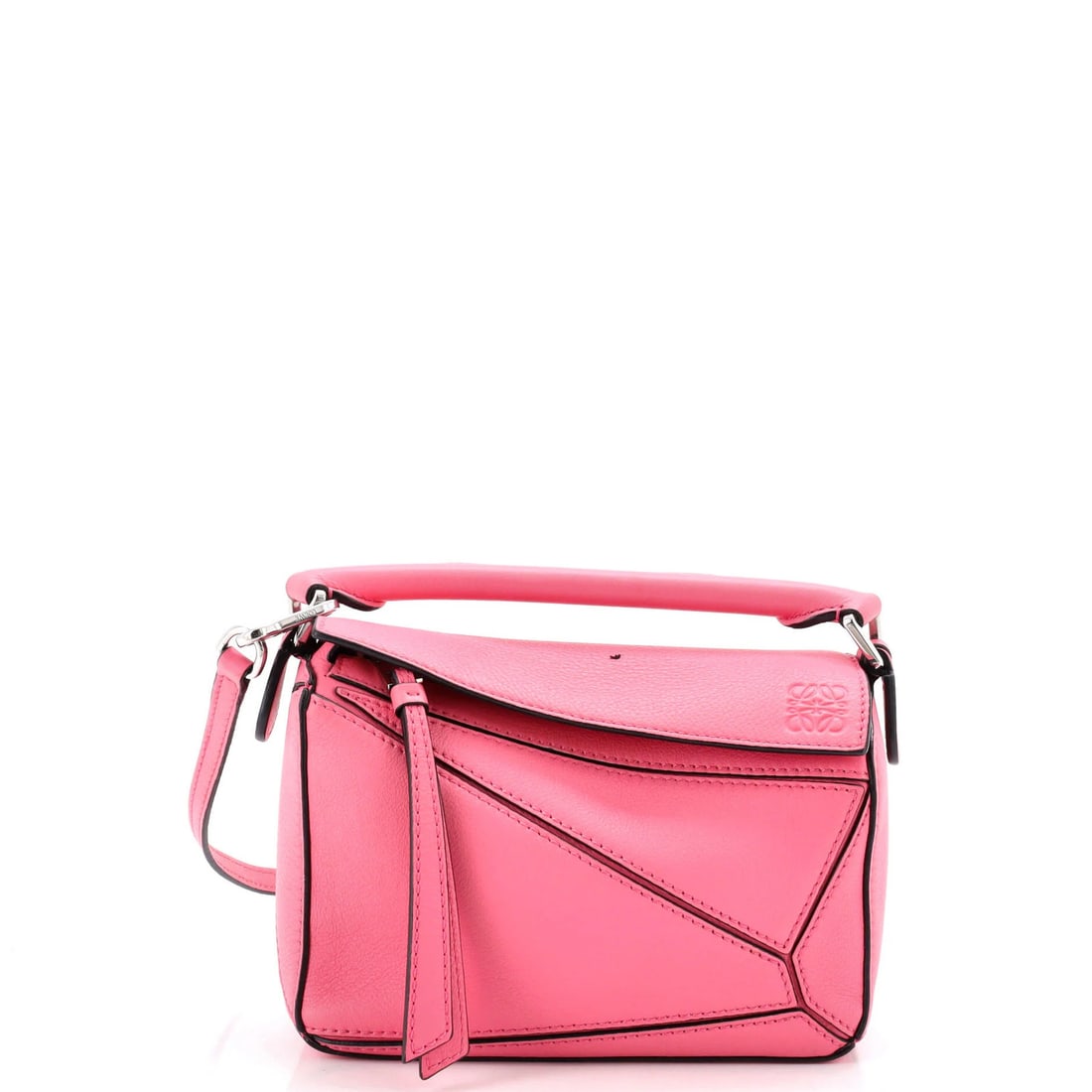 Loewe Puzzle Bag Leather Mini: Loewe Puzzle Bag Leather Mini The Loewe Puzzle Bag Leather Mini is a stylish cross-body bag with a sleek pink leather exterior and neutral interior. Measuring 4.5" tall and 7" wide, this compact bag