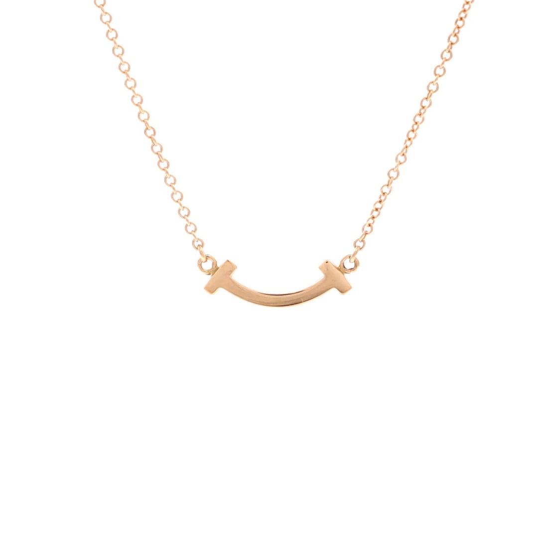 Tiffany Smile Pendant Necklace 18K Rose Gold Mini: Tiffany Smile Pendant Necklace 18K Rose Gold Mini Tiffany & Co.'s 18K Rose Gold Mini Smile Pendant Necklace is a delicate, rose gold masterpiece. This 16.0-18.0" necklace features a 4.65 mm x 14.45