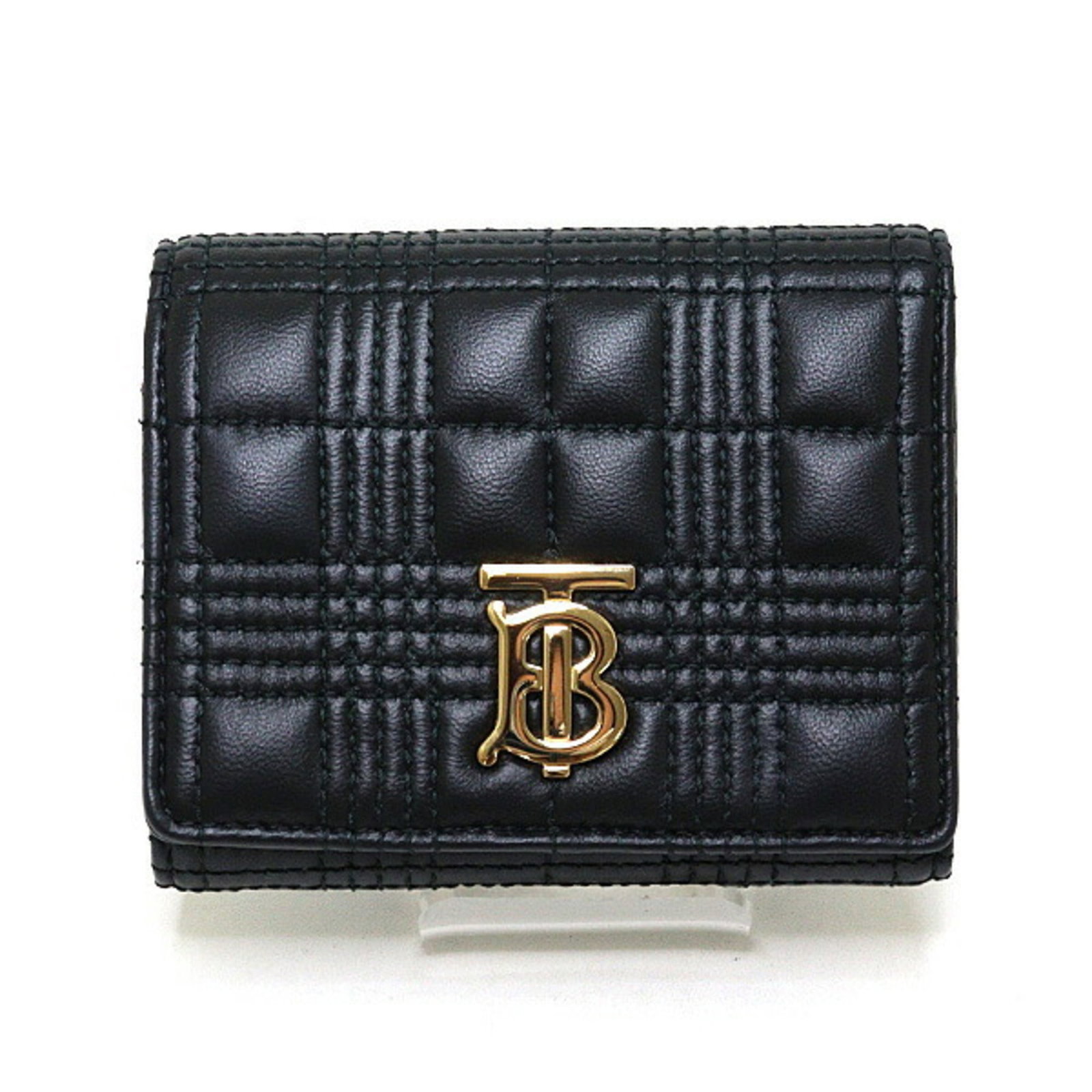 Burberry Wallet (Tri-Fold) Leather: Burberry Wallet (Tri-Fold) Leather Tri-fold leather wallet from Burberry, crafted in Italy with a sleek black finish. The compact design measures 9.5cm x 11.5cm x 3.5cm and comes with a dust bag for