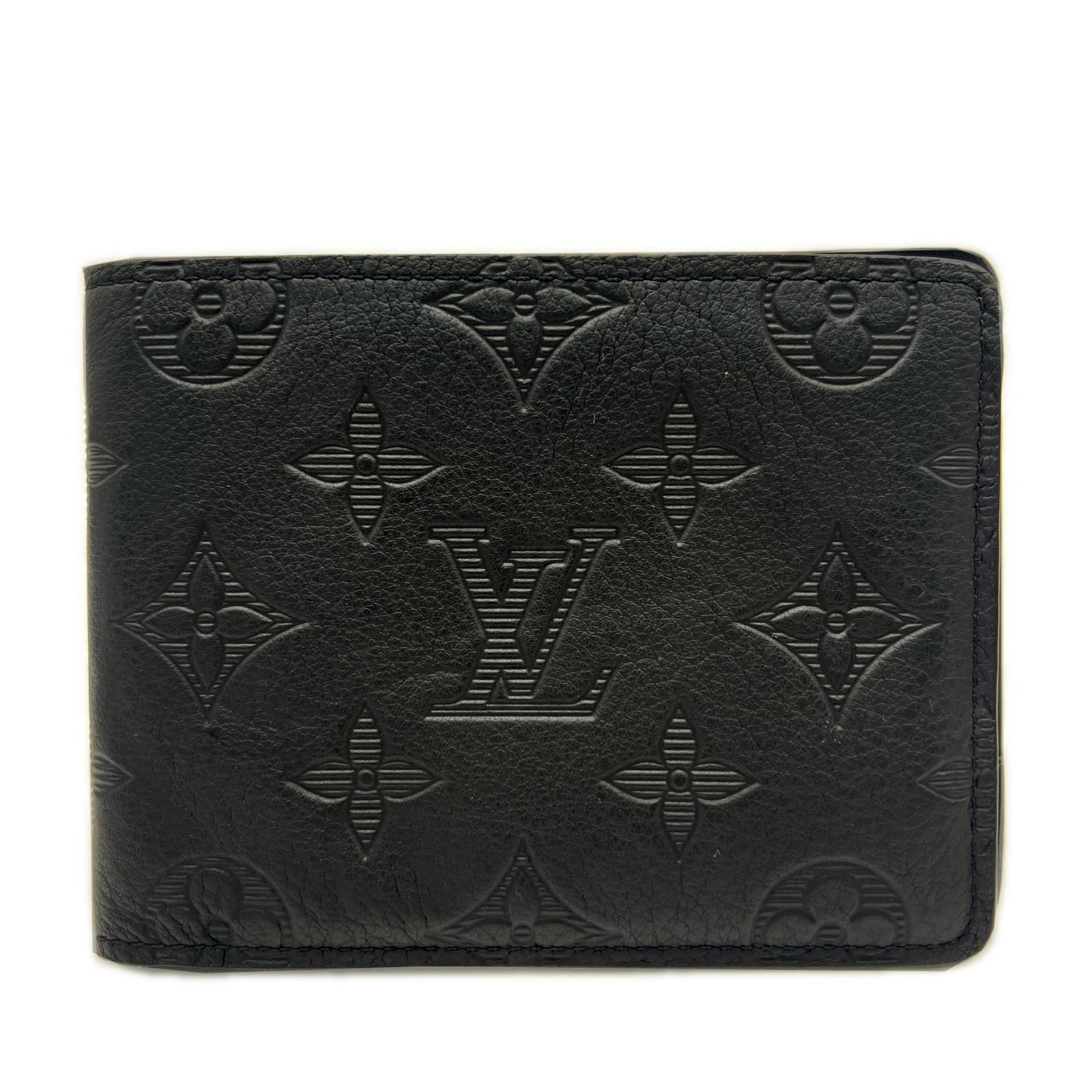 Louis Vuitton Wallet (Bi-Fold) Leather: Louis Vuitton Wallet (Bi-Fold) Leather Black Louis Vuitton bi-fold wallet made from high-quality calf leather, featuring a sleek design and RFID-blocking technology. The wallet's compact size and dura