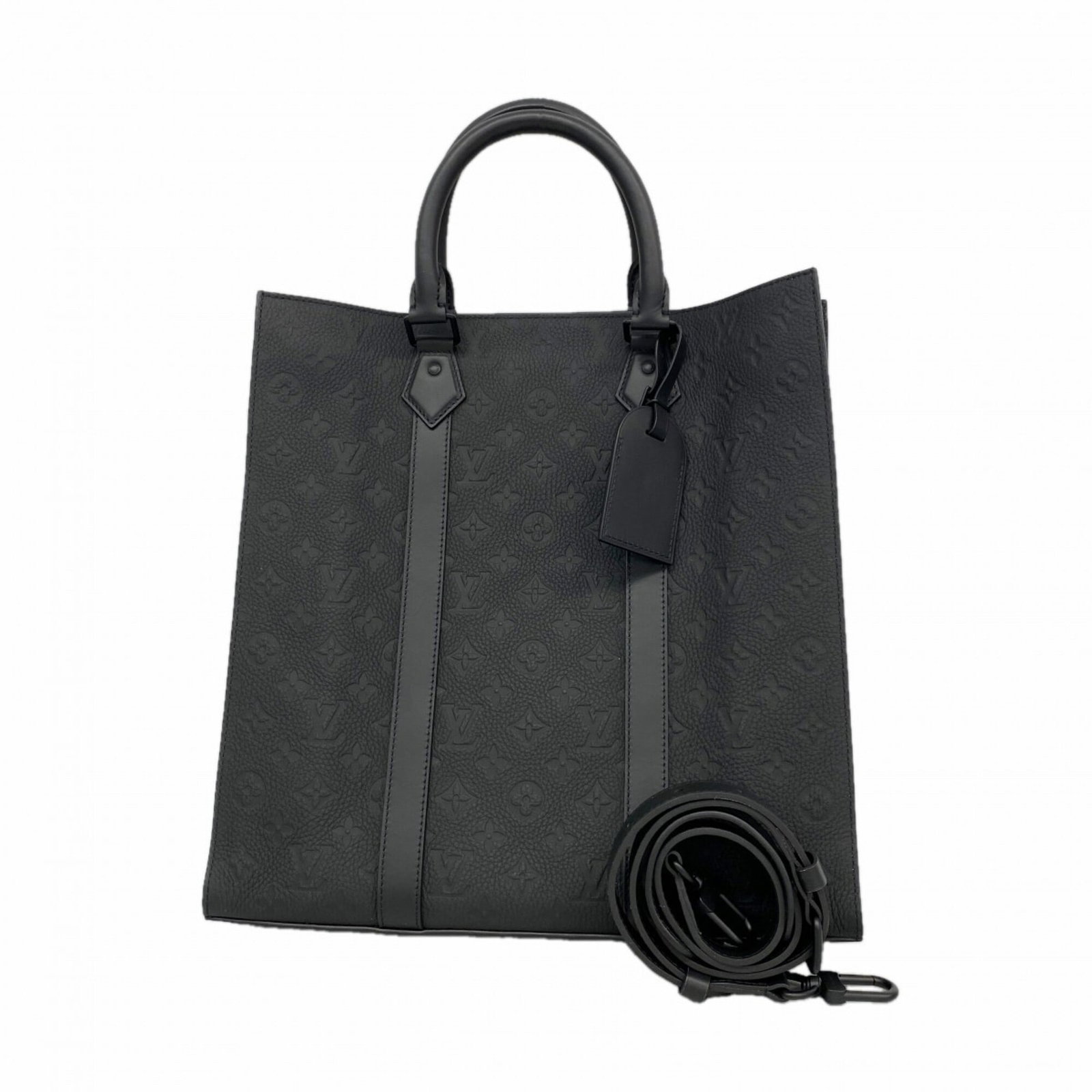 Tote Bag Louis Vuitton: Tote Bag Louis Vuitton Louis Vuitton's Noir Tote Bag boasts a sleek, monochromatic design, measuring 37cm x 36cm x 9cm. The bag's compact size and durable construction make it a practical choice for