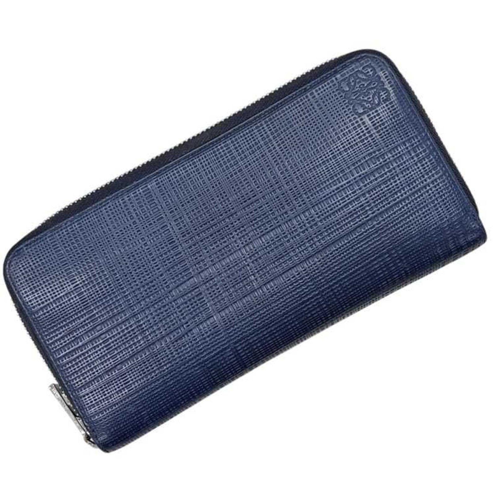 Leather Bi Fold Long Wallet: Leather Bi Fold Long Wallet The Loewe MPN 101N88 Leather Bi Fold Long Wallet boasts a sleek navy leather design, measuring 10cm x 19cm x 2.5cm, perfect for carrying essentials in style. Its classic bi