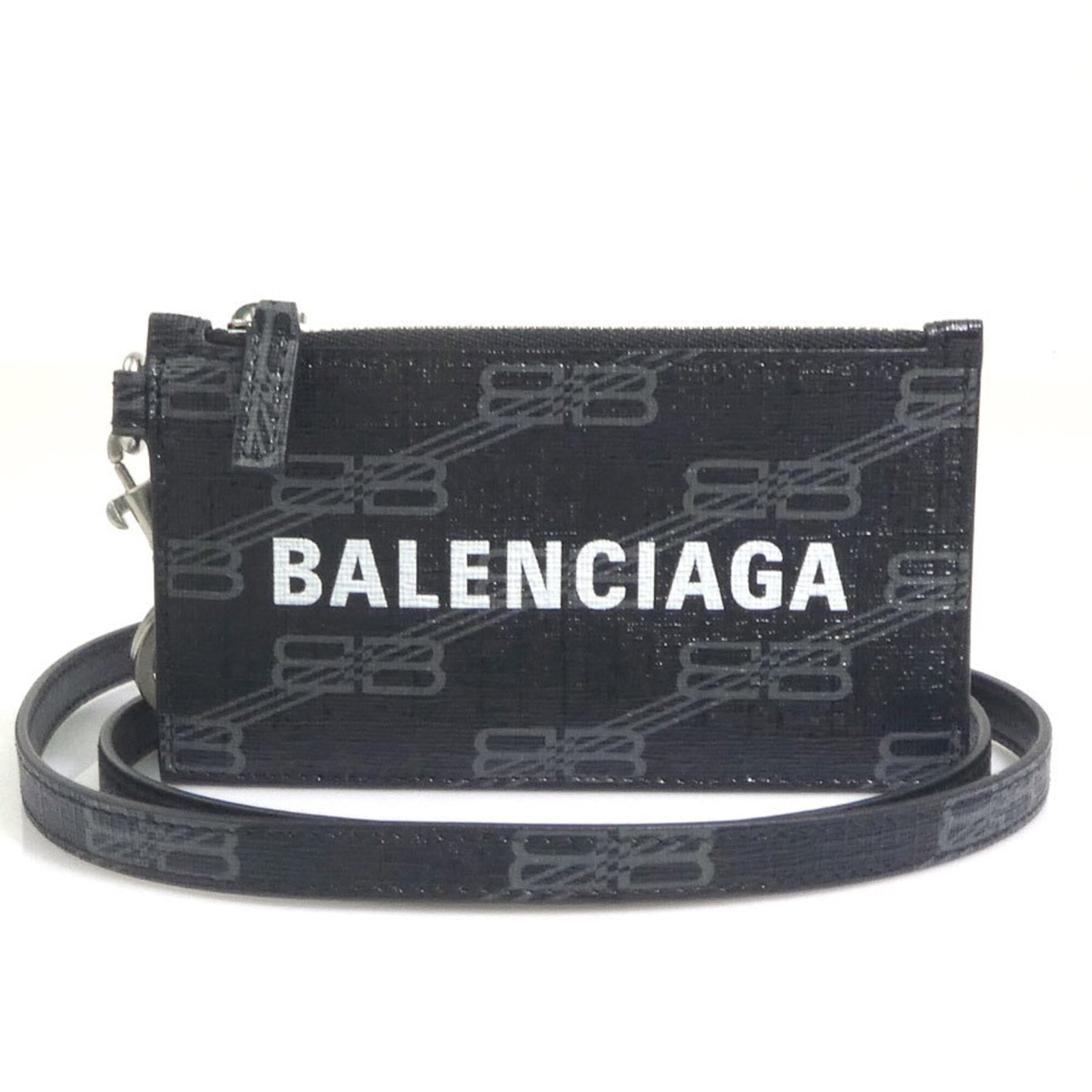 Balenciaga Coin Purse/ Coin Case Leather: Balenciaga Coin Purse/ Coin Case Leather Balenciaga Coin Purse/ Coin Case Leather is made from high-quality leather, available in black, and features a sleek 7cm x 12.5cm size. The Italian design