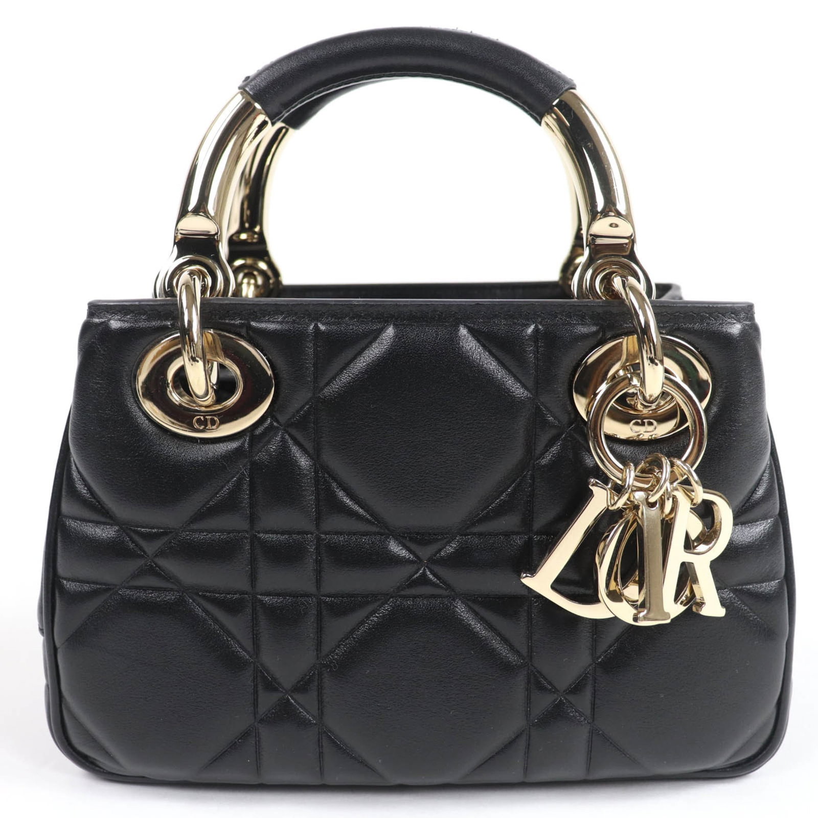 Handbag Christian Dior Leather Shoulder: Handbag Christian Dior Leather Shoulder Black lambskin shoulder bag from Christian Dior, featuring gold hardware, an open zipper pocket, and a spacious inner pocket. The bag is made from high-quality 