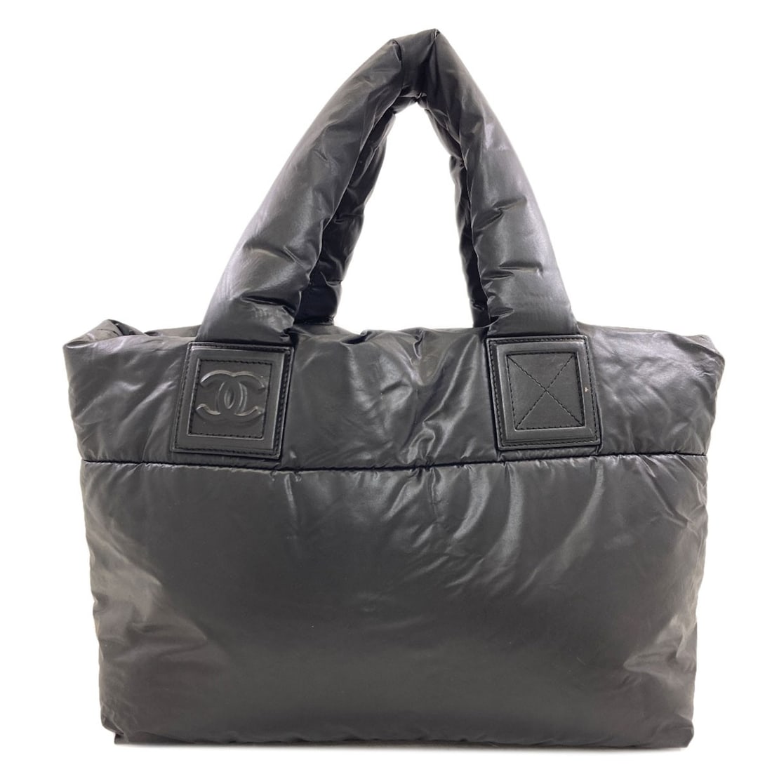 Chanel Cococoon Tote Bag Nylon: Chanel Cococoon Tote Bag Nylon The Chanel Cococoon Tote Bag Nylon is a sleek and versatile black tote with a classic design. Made from durable nylon, this bag features a signature Chanel style with