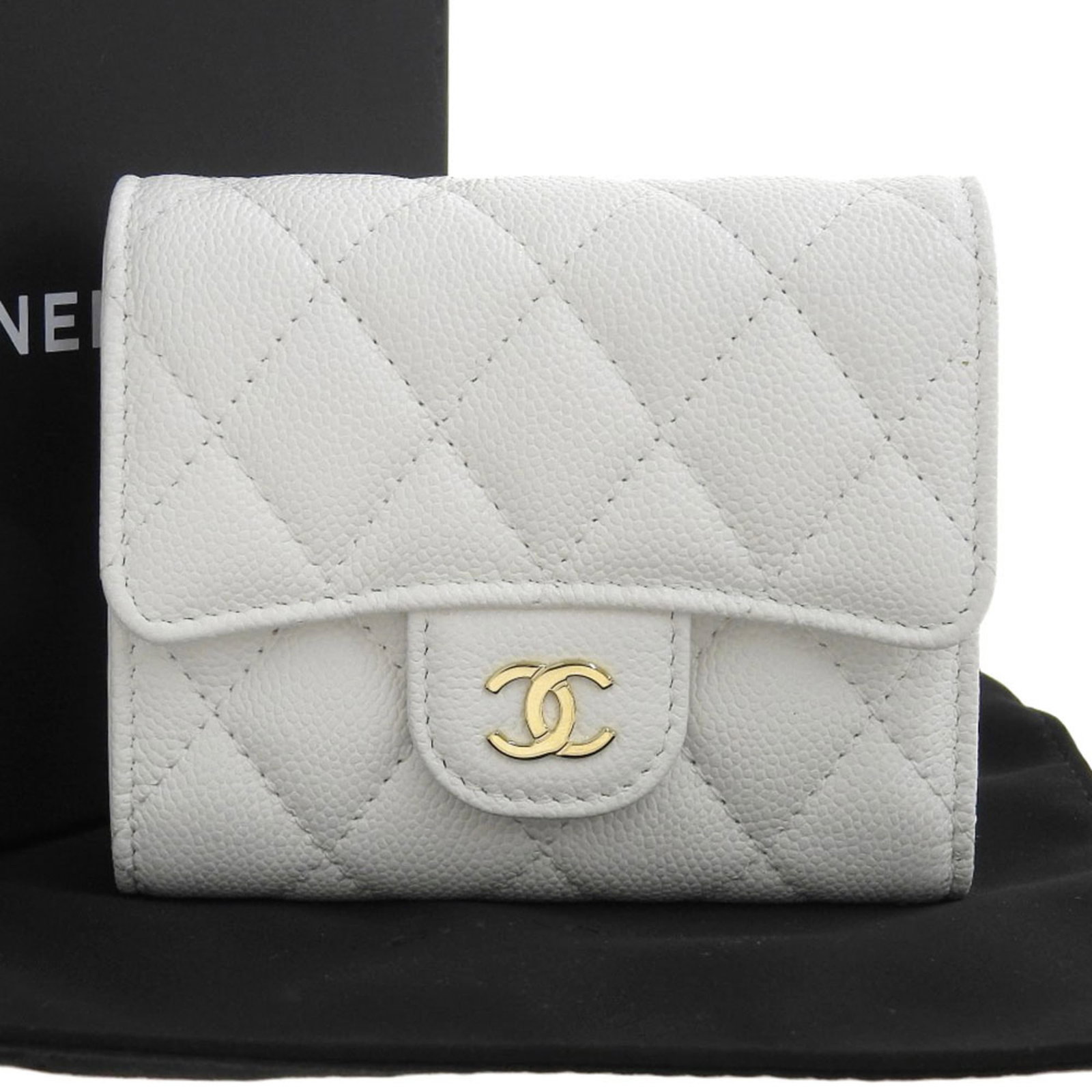 Caviar Leather Tri-Fold Wallet: Caviar Leather Tri-Fold Wallet Caviar leather adds a touch of sophistication to this tri-fold wallet, with its sleek white design and precise dimensions. The wallet comes with a luxurious box and dust