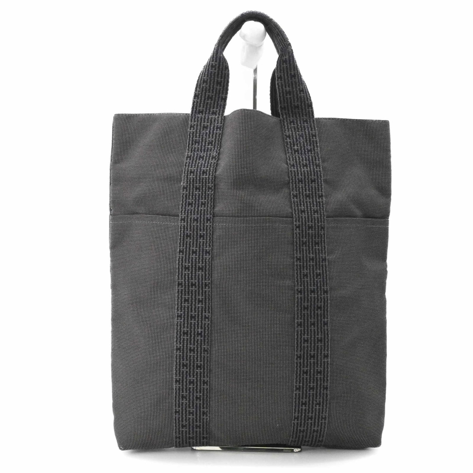 Handbag Tote Bag Canvas Hermes: Handbag Tote Bag Canvas Hermes Canvas Hermes Handbag Tote Bag in Gray. This canvas tote bag features a classic design with a 40cm x 36cm x 6.5cm size, making it a practical and stylish accessory for