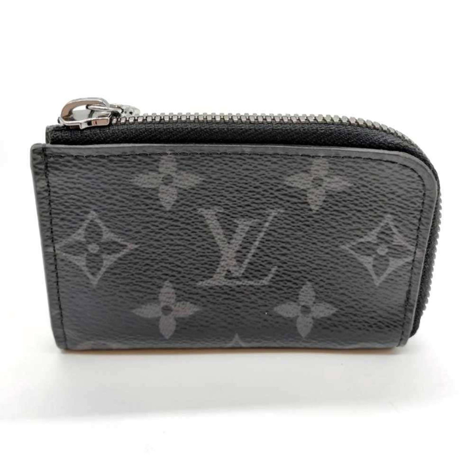 Louis Vuitton Eclipse Coin Monogram Purse: Louis Vuitton Eclipse Coin Monogram Purse The Louis Vuitton Eclipse Coin Monogram Purse is a sleek and sophisticated accessory, featuring the iconic Monogram Eclipse pattern in black. Measuring 7cm x 