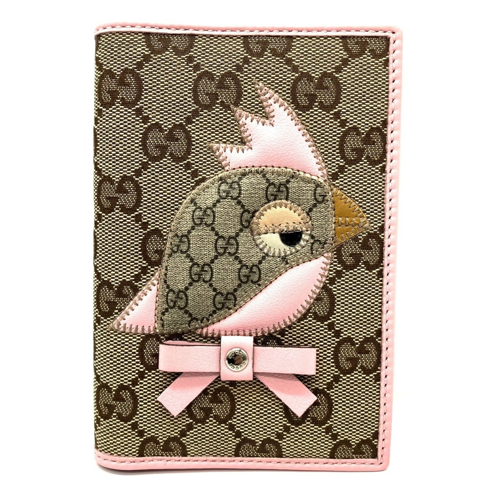 Gucci Canvas Leather Passport Cover: Gucci Canvas Leather Passport Cover Gucci's canvas leather passport cover is a stylish accessory, made from GG canvas and leather, with a signature touch. Measuring 14cm x 9.5cm x 1.5cm, this compact