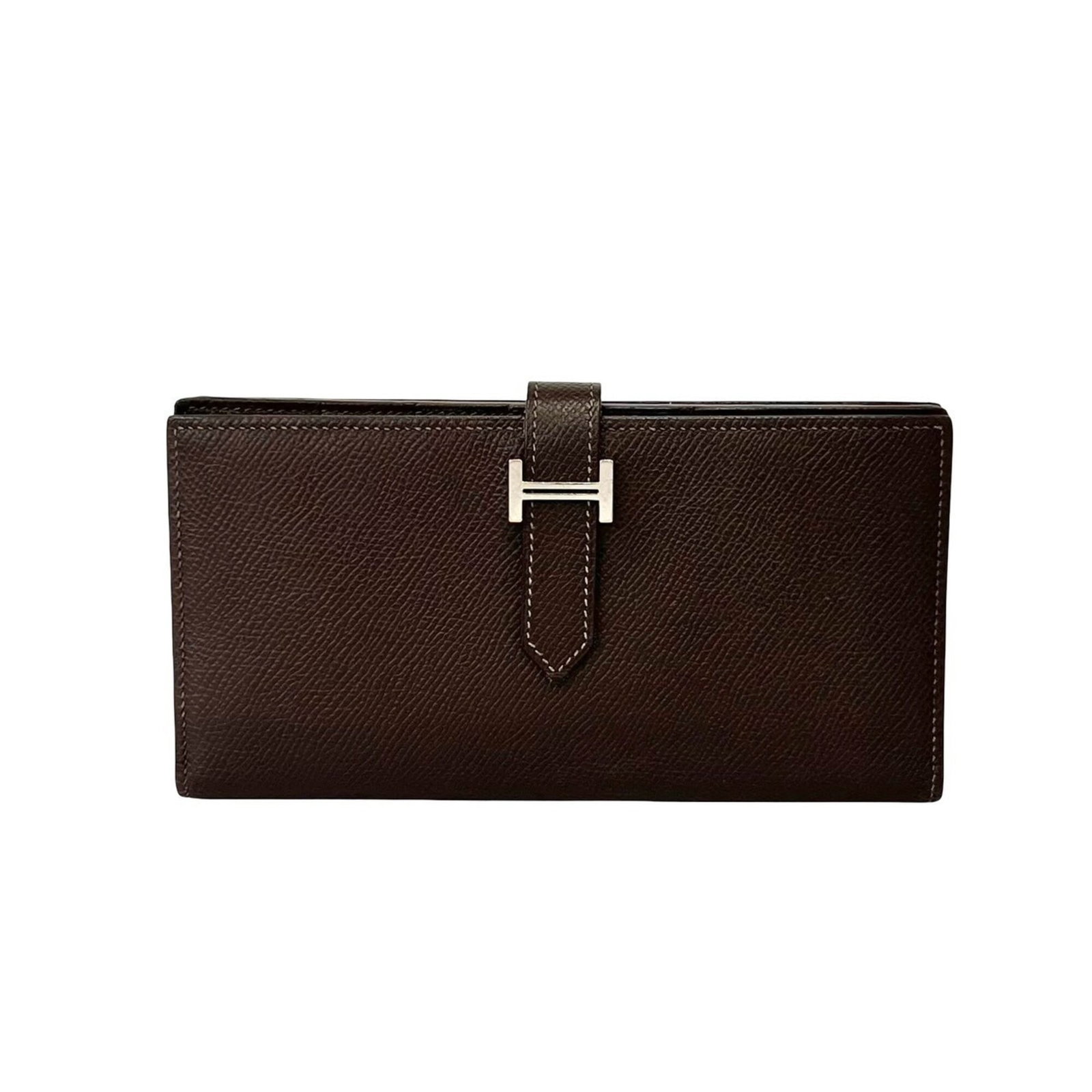 Epsom Leather Bi fold Wallet Hermes: Epsom Leather Bi fold Wallet Hermes Epsom leather gives this bi-fold wallet a rich, luxurious feel. With its classic design and elegant brown color, it's a timeless accessory for everyday use.