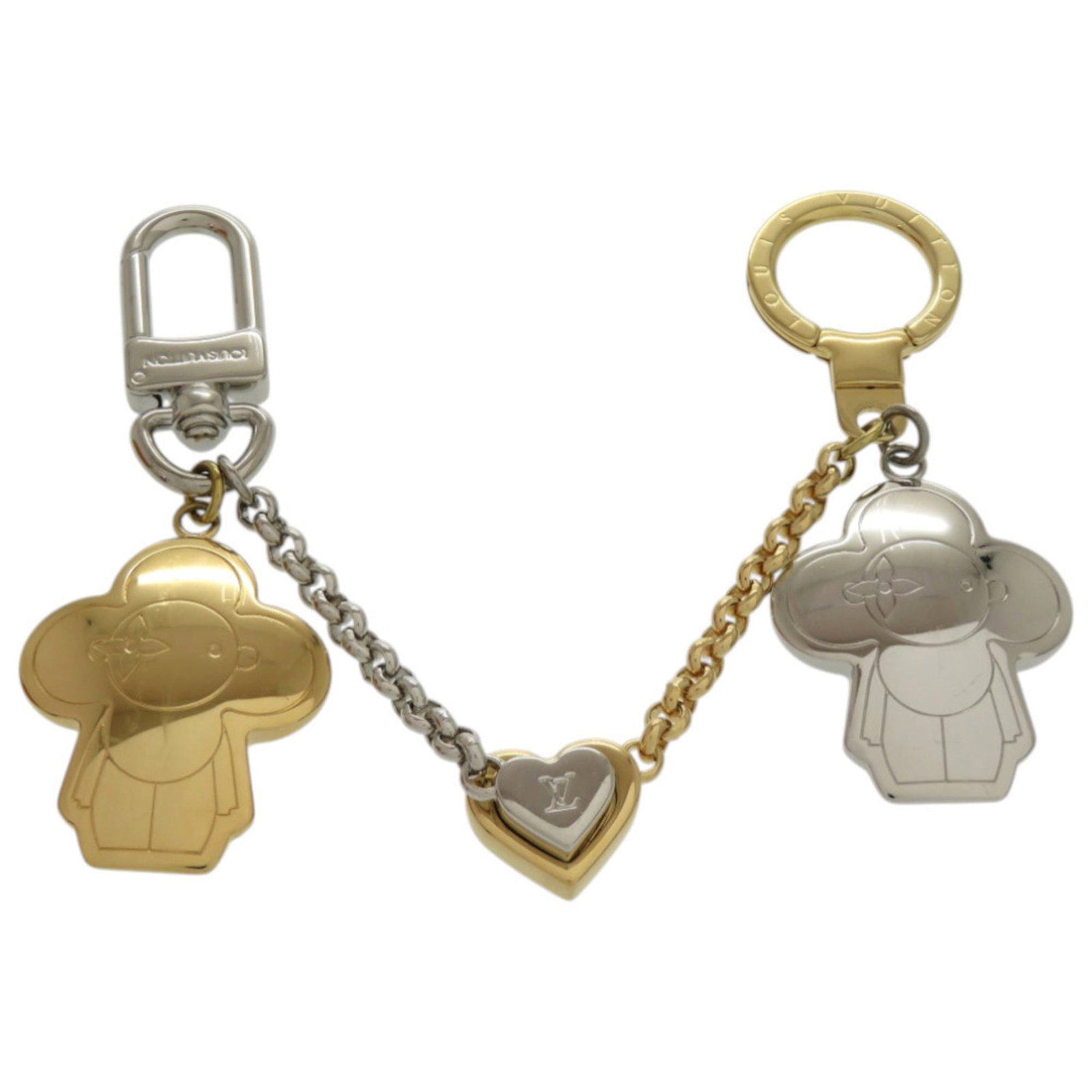 Vuitton Metal Louis Keyring: Vuitton Metal Louis Keyring Metal keyring bearing the iconic Louis Vuitton logo, crafted from high-quality metal with a sleek gold or silver finish. Measuring 4.5cm x 3.5cm, this compact keyring is a