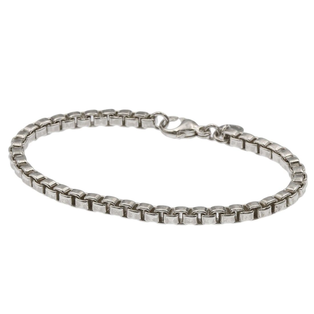 Venetian Silver Tiffany Co. Bracelet: Venetian Silver Tiffany Co. Bracelet Tiffany & Co.'s Venetian Silver bracelet is a sleek and sophisticated accessory, crafted from high-quality silver metal. With its elegant design and understated