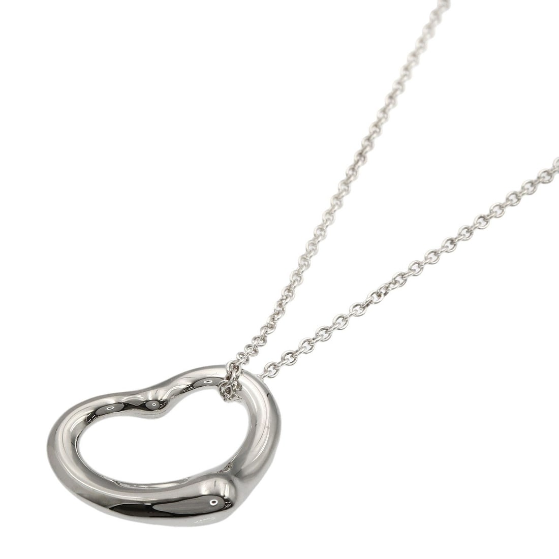 Open Heart Necklace by Tiffany & Co: Open Heart Necklace by Tiffany & Co Silver Open Heart Necklace by Tiffany & Co. features a sleek and modern design. Made from silver metal, this 16.1-inch necklace boasts a striking silver exterior.