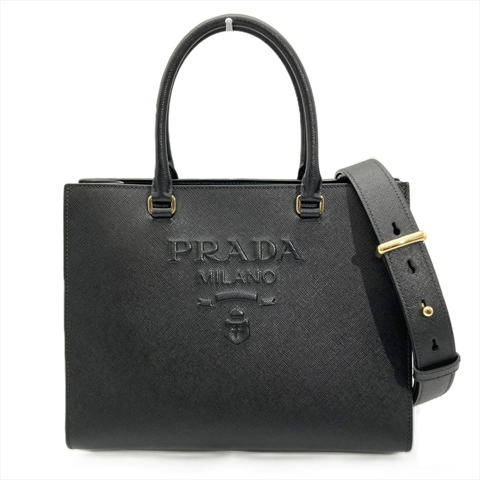Saffiano Prada Bag Shoulder: Saffiano Prada Bag Shoulder Saffiano Prada Bag Shoulder in Black. This sleek shoulder bag features a durable Saffiano material, gold hardware, and a classic design. Measuring 22cm x 28cm x 10cm, it ha