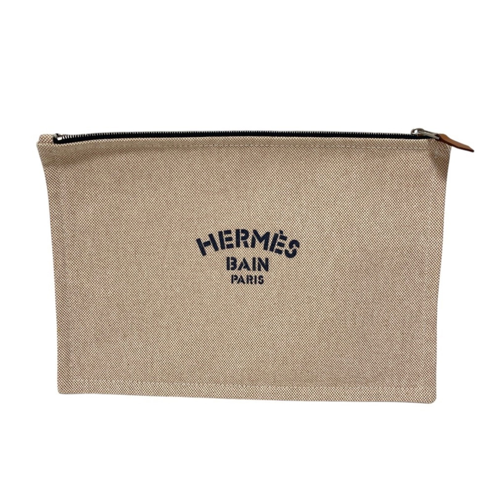 Pouch Canvas Hermes: Pouch Canvas Hermes Canvas pouch from the iconic brand Hermes, available in a natural beige color. This 20cm x 28cm canvas pouch features a classic design that exudes timeless elegance. With its simpl