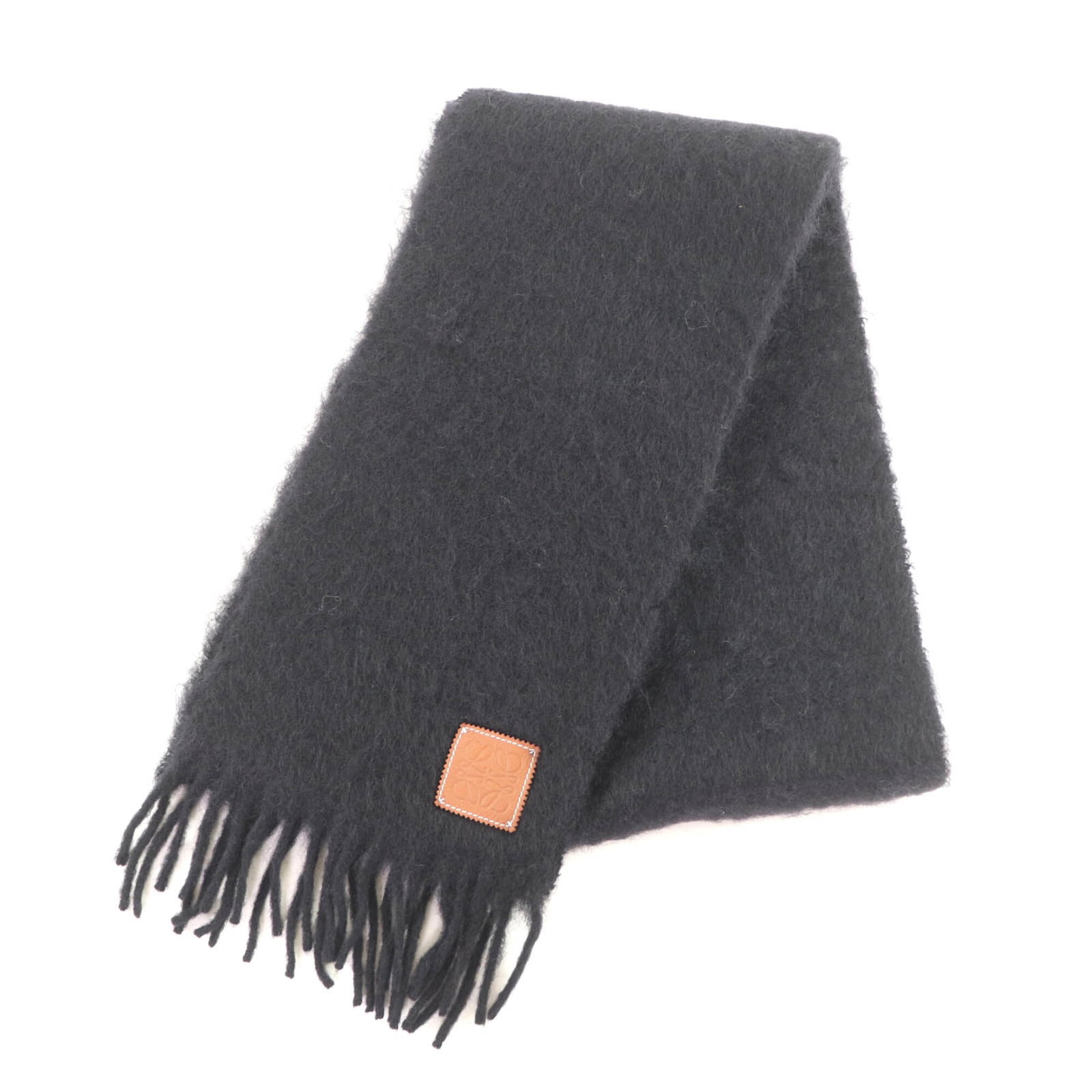 Loewe Stole Mohair Wool 50 48 Nylon: Loewe Stole Mohair Wool 50 48 Nylon Loewe Stole is a stylish and luxurious piece, featuring a combination of mohair, wool, and nylon materials. This black stole measures 1.82m x 24cm, making it a vers