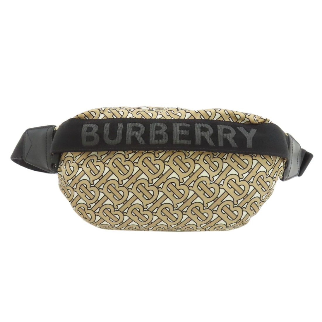 Body Bag Nylon Burberry Tbmonogram: Body Bag Nylon Burberry Tbmonogram Beige body bag with a Burberry TB monogram made from nylon. This style is characterized by its simple, understated design and durable nylon material. The beige