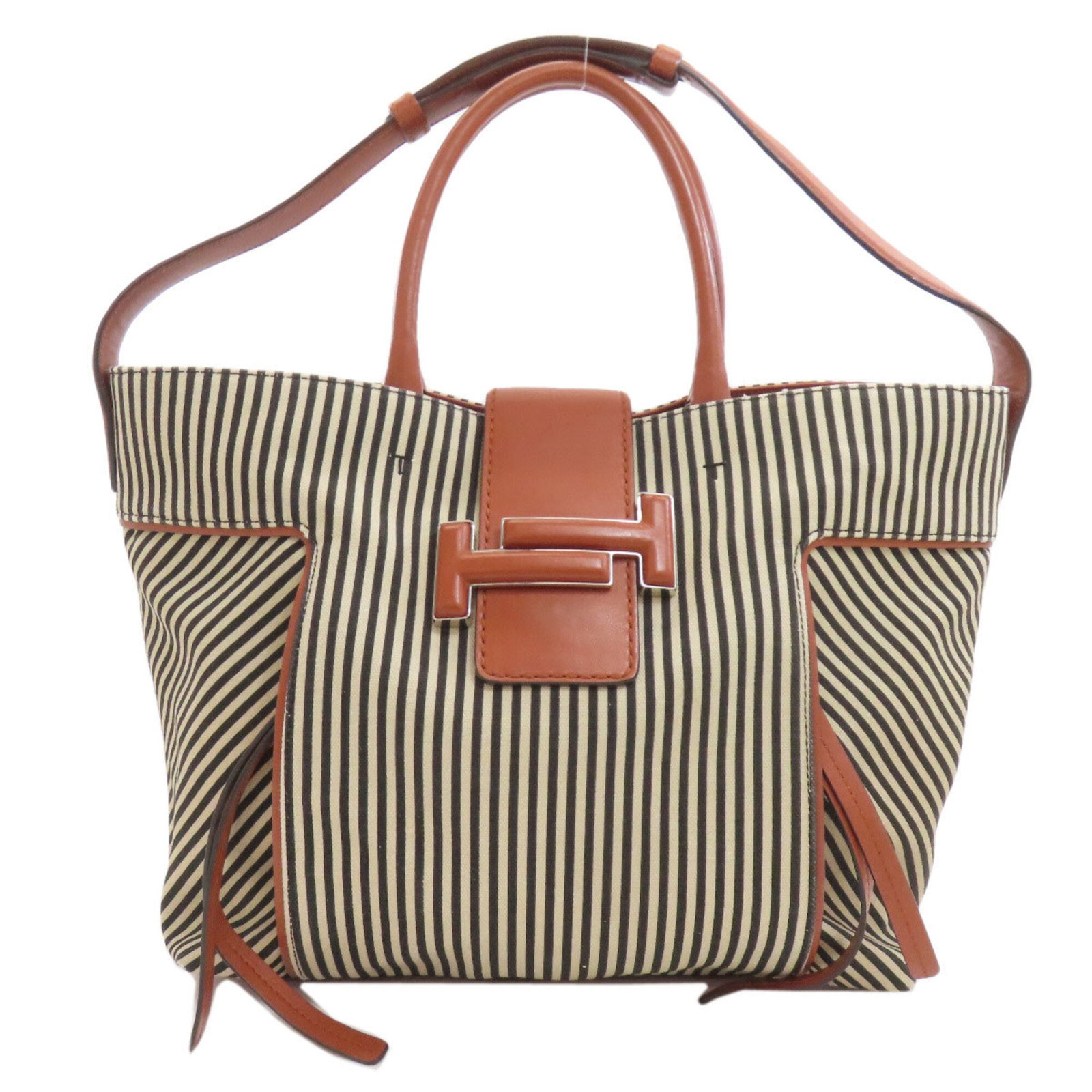 Canvas tote bag by Tod's: Canvas tote bag by Tod's Tod's canvas tote bag boasts a rich brown hue and sturdy canvas material, measuring 29cm x 31cm x 13cm. The bag's compact size and simple design make it a practical and