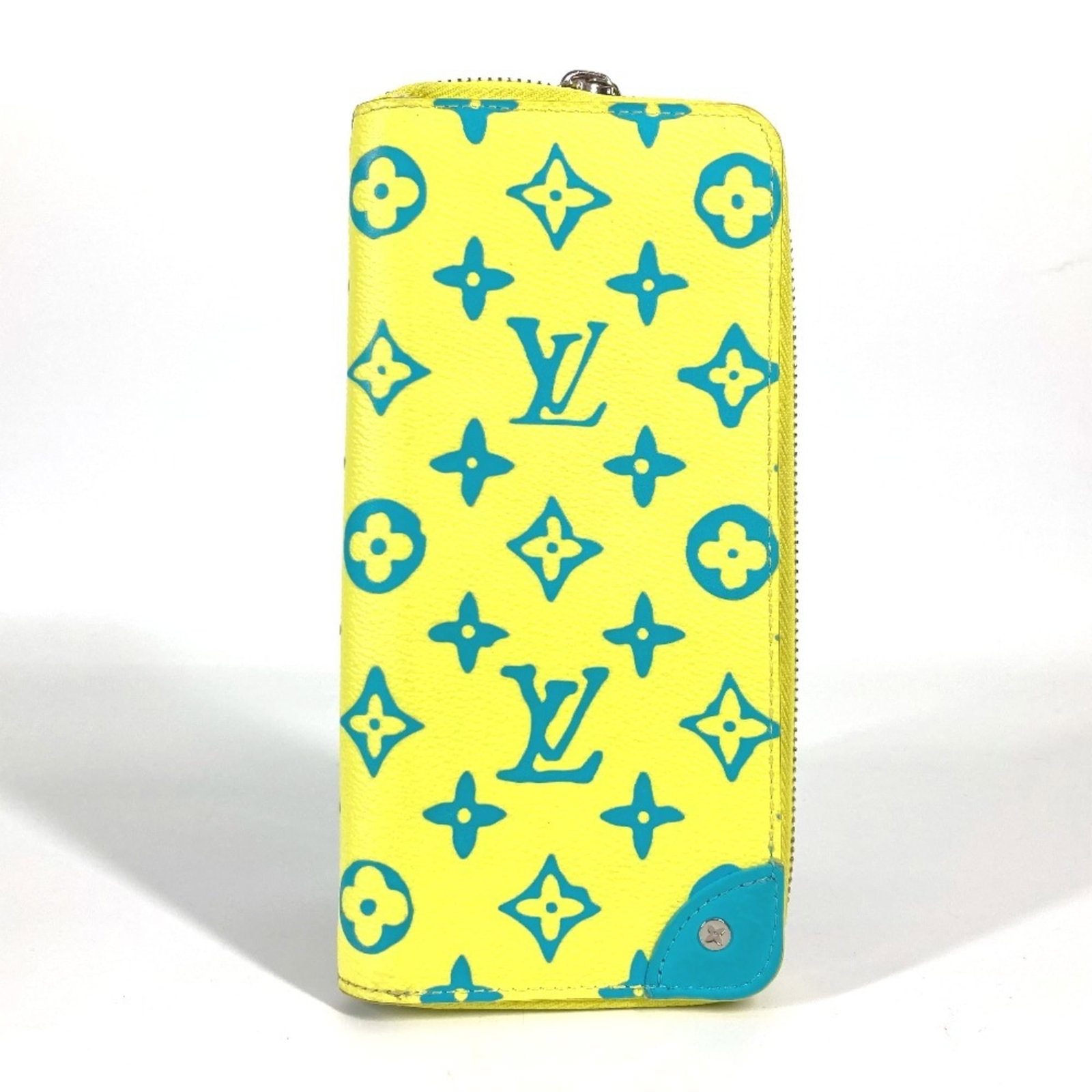 Long Wallet (Bi-Fold) Leather Monogram Louis Vuitton: Long Wallet (Bi-Fold) Leather Monogram Louis Vuitton Monogrammed with a striking blue and yellow design, this Long Wallet (Bi-Fold) from Louis Vuitton boasts a classic, timeless design. Made from high