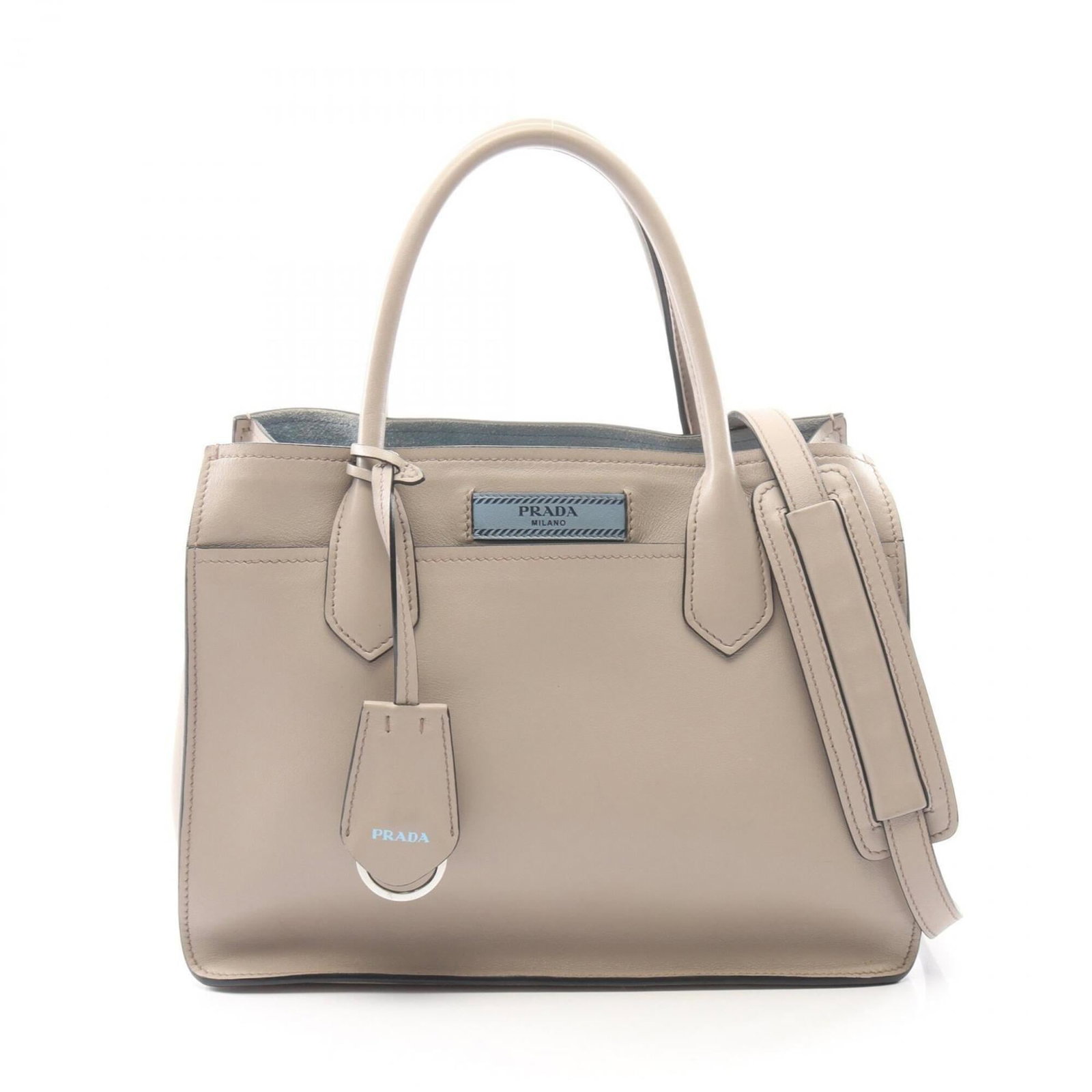 Handbag Leather Prada: Handbag Leather Prada The beige Prada handbag boasts a classic design with a timeless leather finish, measuring 21cm x 26cm x 13cm. Its understated elegance makes it a versatile accessory for everyday