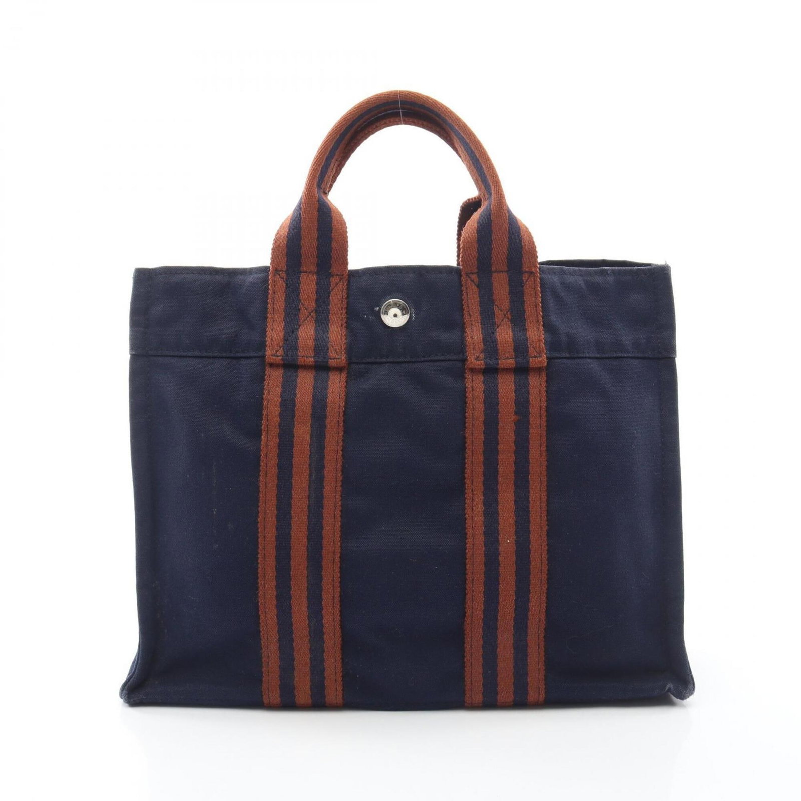Handbag Tote Bag Canvas Hermes: Handbag Tote Bag Canvas Hermes Canvas tote bag from Hermes, featuring a classic brown and navy color combination. Made from high-quality canvas, this bag measures 23cm x 30cm x 8cm and has a timeless