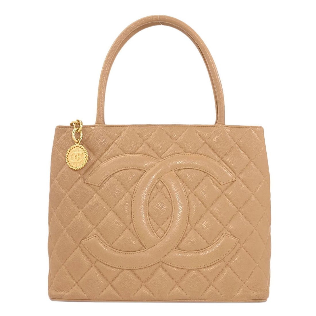 Chanel Medallion Goldhardware Tote Bag Grained Calfskin Skin: Chanel Medallion Goldhardware Tote Bag Grained Calfskin Skin Beige Grained Calfskin Skin Tote Bag from CHANEL, featuring a classic design with gold hardware. This timeless tote bag is crafted from