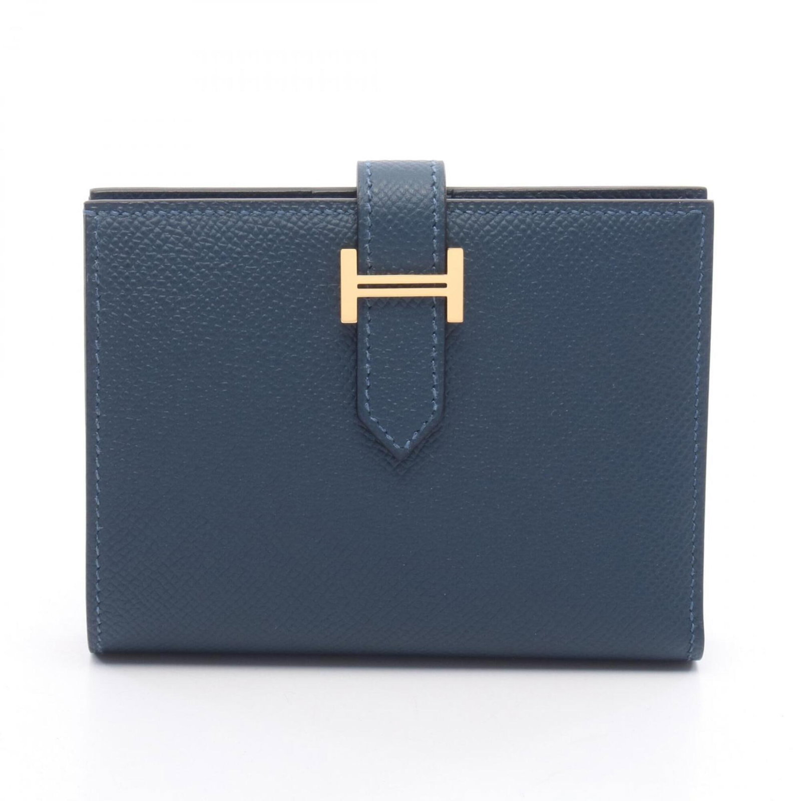 Bi fold Epsom Leather Hermes Wallet: Bi fold Epsom Leather Hermes Wallet Epsom leather provides a rich, luxurious feel to this bi-fold wallet from Hermes, with a sleek blue hue that adds a touch of sophistication. Measuring 9cm x 12cm x