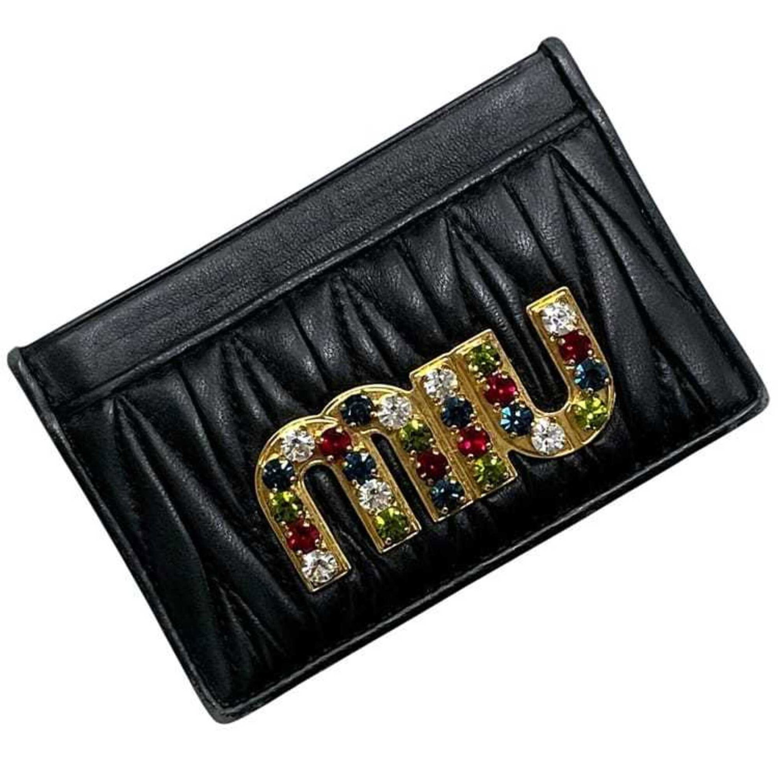 Case Card Leather Miu: Case Card Leather Miu Black leather card case from Miu Miu, measuring 7cm x 10.5cm x 1.5cm. Made from high-quality leather, this compact case features a sleek design that fits perfectly in a purse or