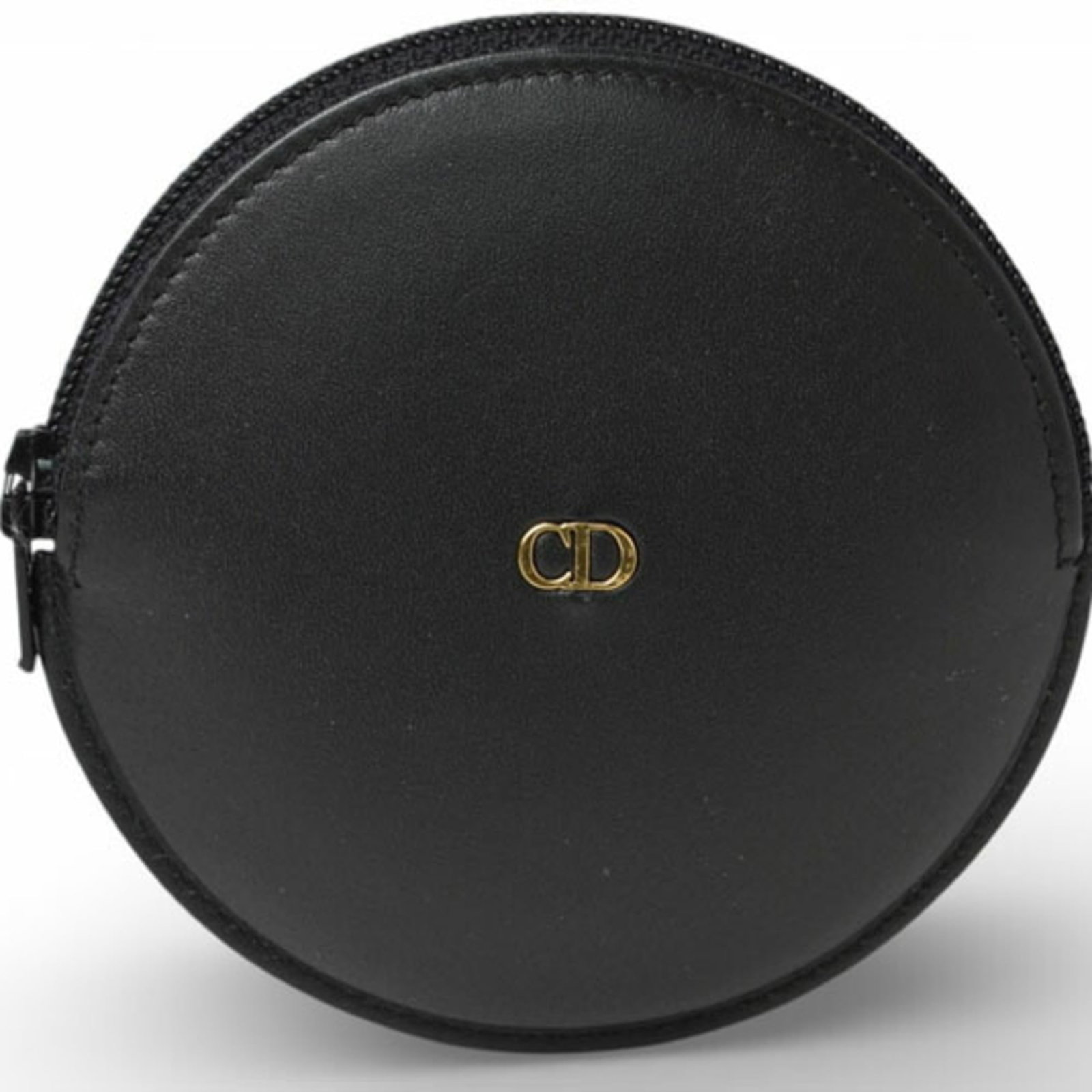 Dior Christian Coin Leather Purse: Dior Christian Coin Leather Purse Christian Dior's Coin Leather Purse is a sleek and sophisticated accessory, crafted from high-quality black leather. Measuring 9cm x 9cm x 1.5cm, this compact coin