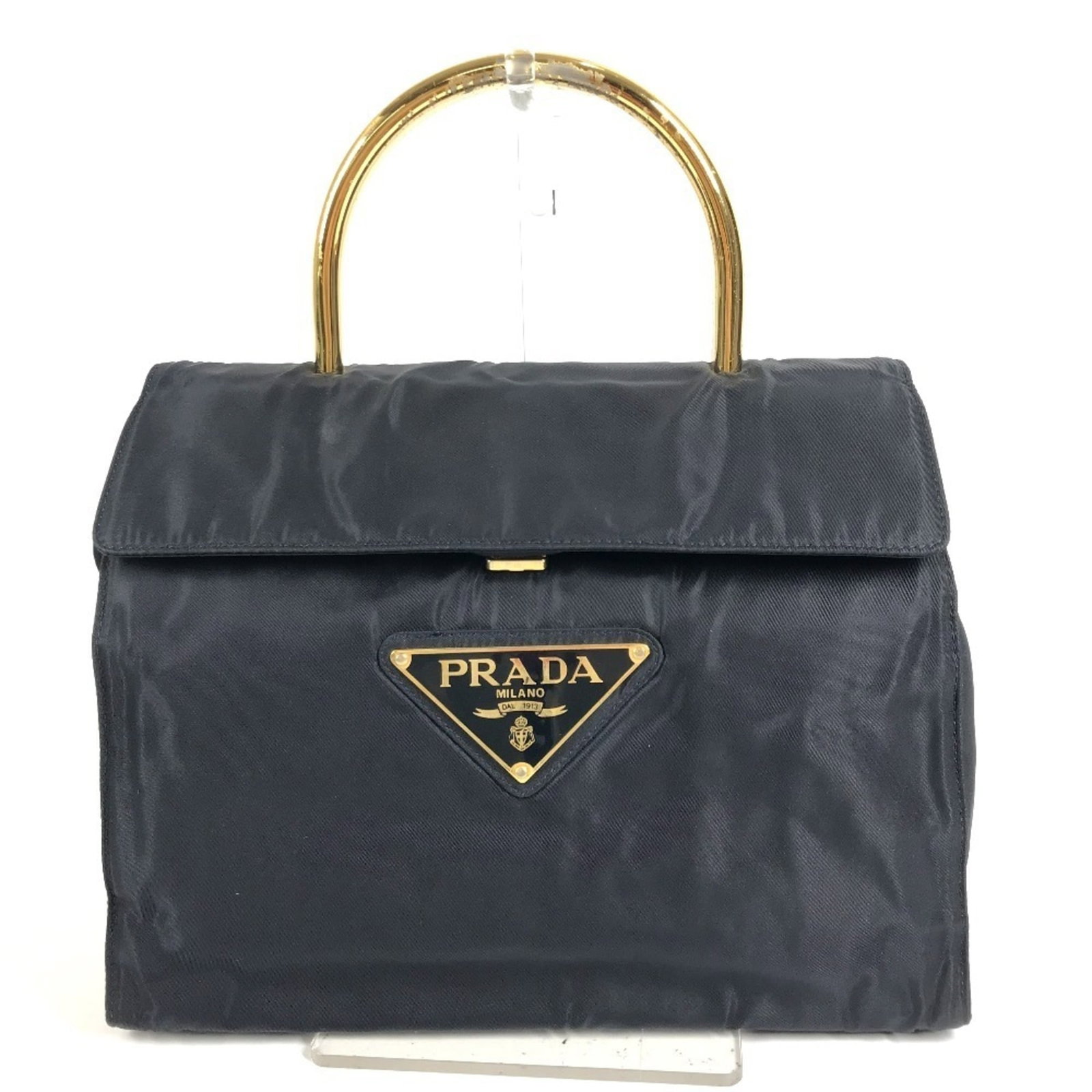 Tote Nylon Prada Handbag: Tote Nylon Prada Handbag Navy nylon tote bag from Prada, measuring 22cm x 30cm x 9.5cm, offering a stylish and functional accessory for daily use. Made from high-quality nylon material, this tote bag