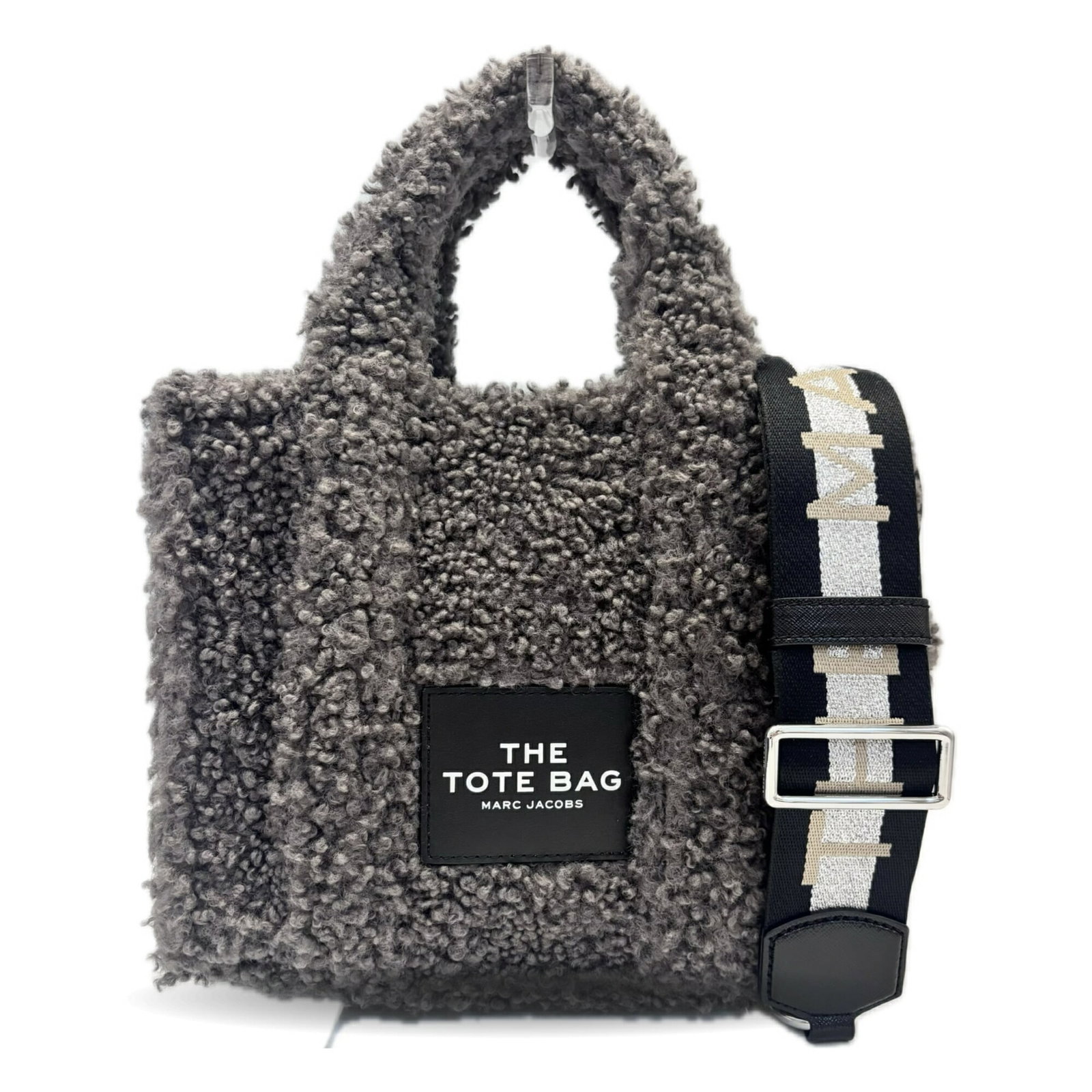 Polyester Tote Bag by Marc Jacobs: Polyester Tote Bag by Marc Jacobs Gray polyester tote bag by Marc Jacobs, featuring a sturdy 555g weight and adjustable strap length of 85cm - 135cm. This versatile bag measures 21cm x 25.5cm x 13cm