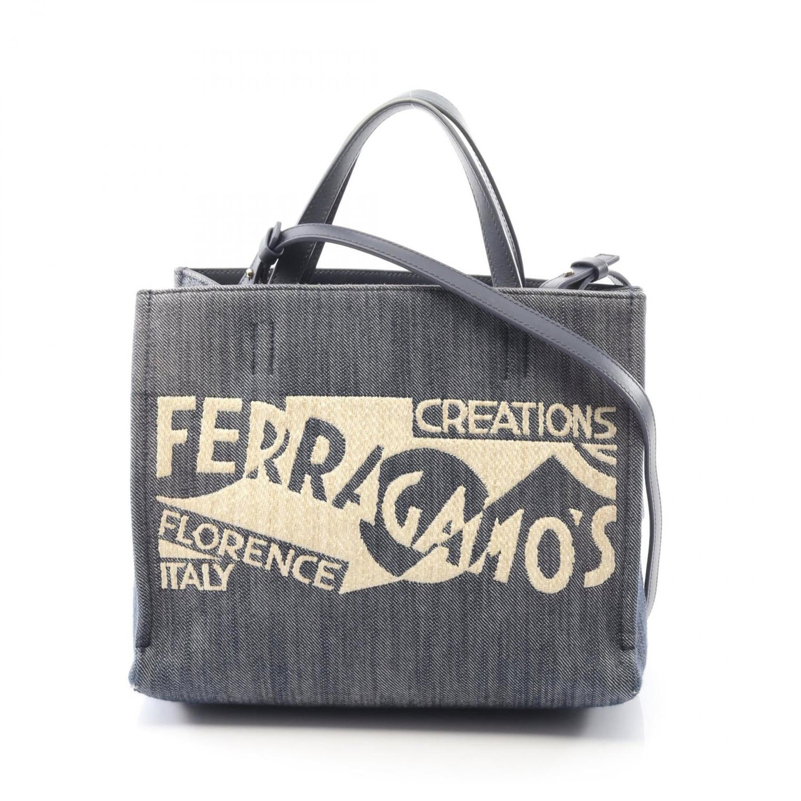 Denim Leather Handbag Ferragamo Salvatore: Denim Leather Handbag Ferragamo Salvatore Denim Leather Handbag Ferragamo Salvatore features a unique blend of denim and leather materials, presented in a navy color. The handbag measures 21cm x 26cm