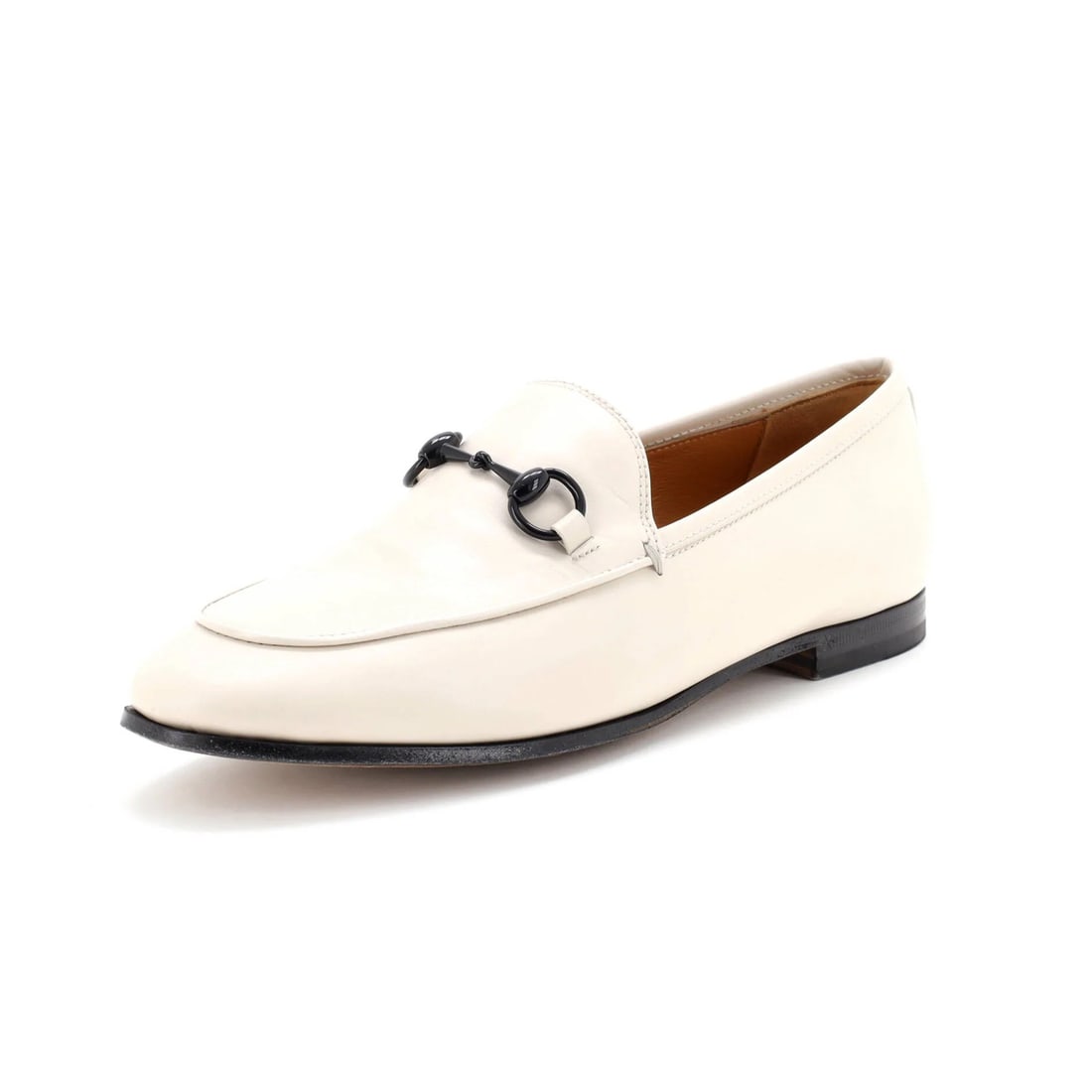 Women's Jordaan Loafers Leather Gucci: Women's Jordaan Loafers Leather Gucci Neutral-colored Gucci loafers with a classic design, featuring leather upper and interior, and black hardware, available in size 7 (US/W 37). The shoes show