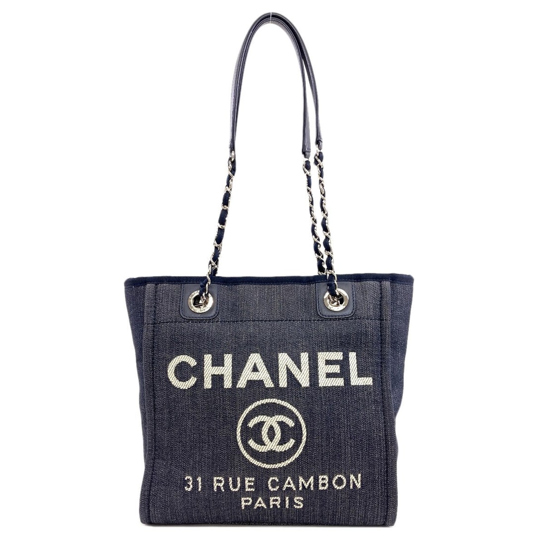 Chanel A66939 Deauville Pm Silverhardware Tote Bag Canvas: Chanel A66939 Deauville Pm Silverhardware Tote Bag Canvas Navy canvas tote bag with silver hardware, measuring 9.8-12.6 inches in width and 9.8 inches in height, features a magnetic closure and a