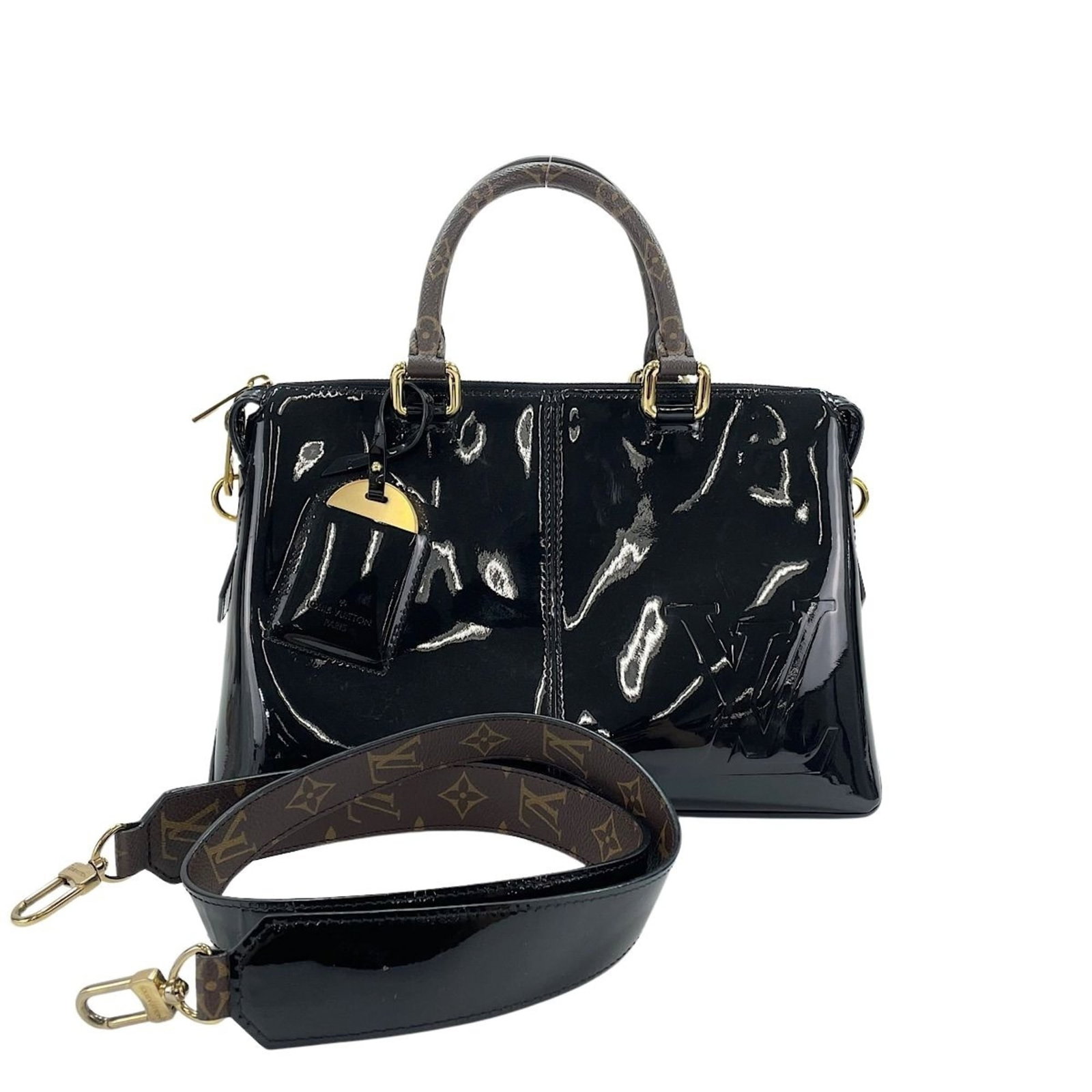 Handbag Louis Vuitton: Handbag Louis Vuitton Black Louis Vuitton handbag with 103cm strap length and 10cm handle drop. This stylish bag measures 32cm x 19cm x 14cm and features a sleek design. Item Specifics: Brand: Louis