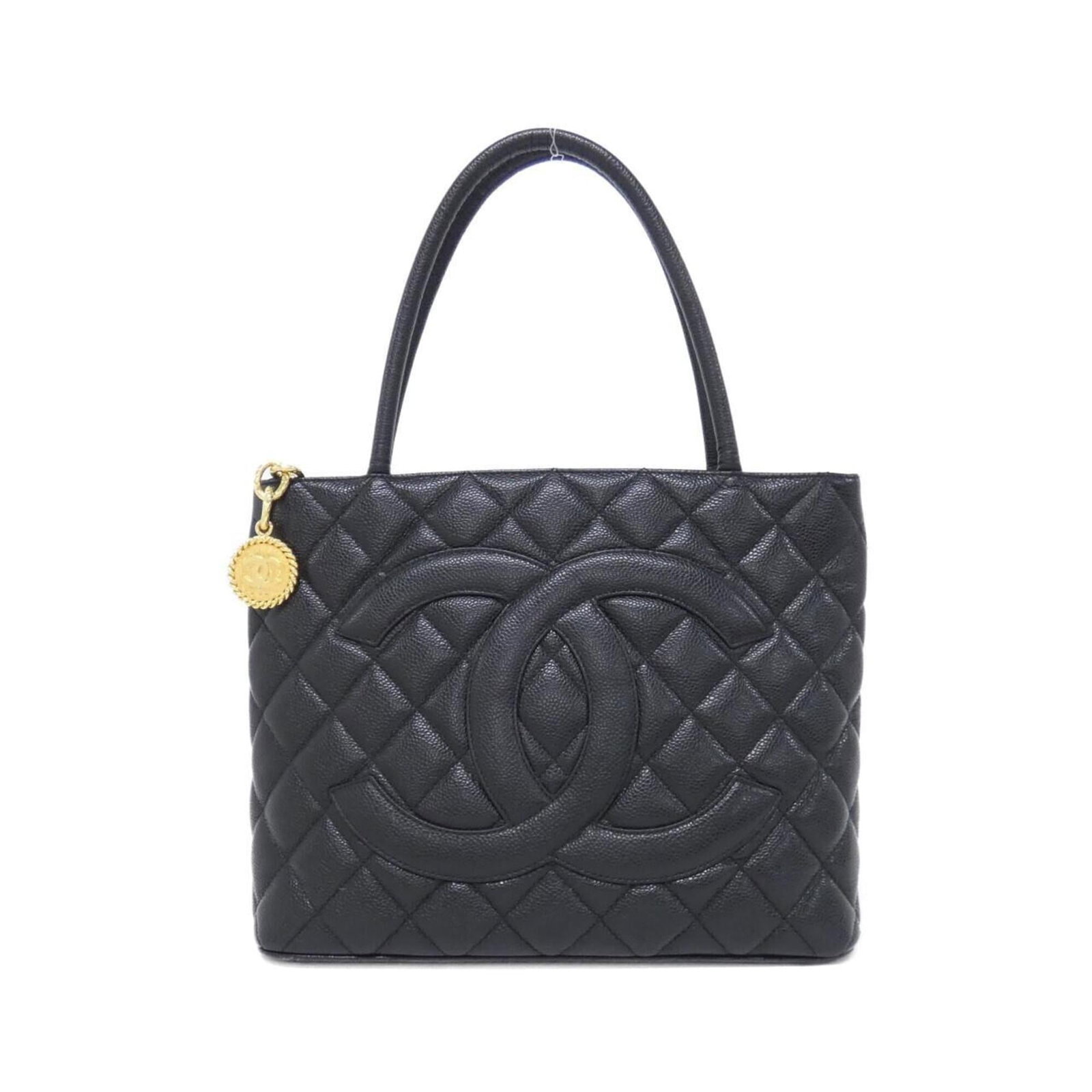 Calfskin Handbag Chanel: Calfskin Handbag Chanel Calfskin Handbag Chanel features a sleek black design made from high-quality Grained Calfskin, with a size of 25cm x 30cm x 14cm. The bag's classic style and timeless elegance