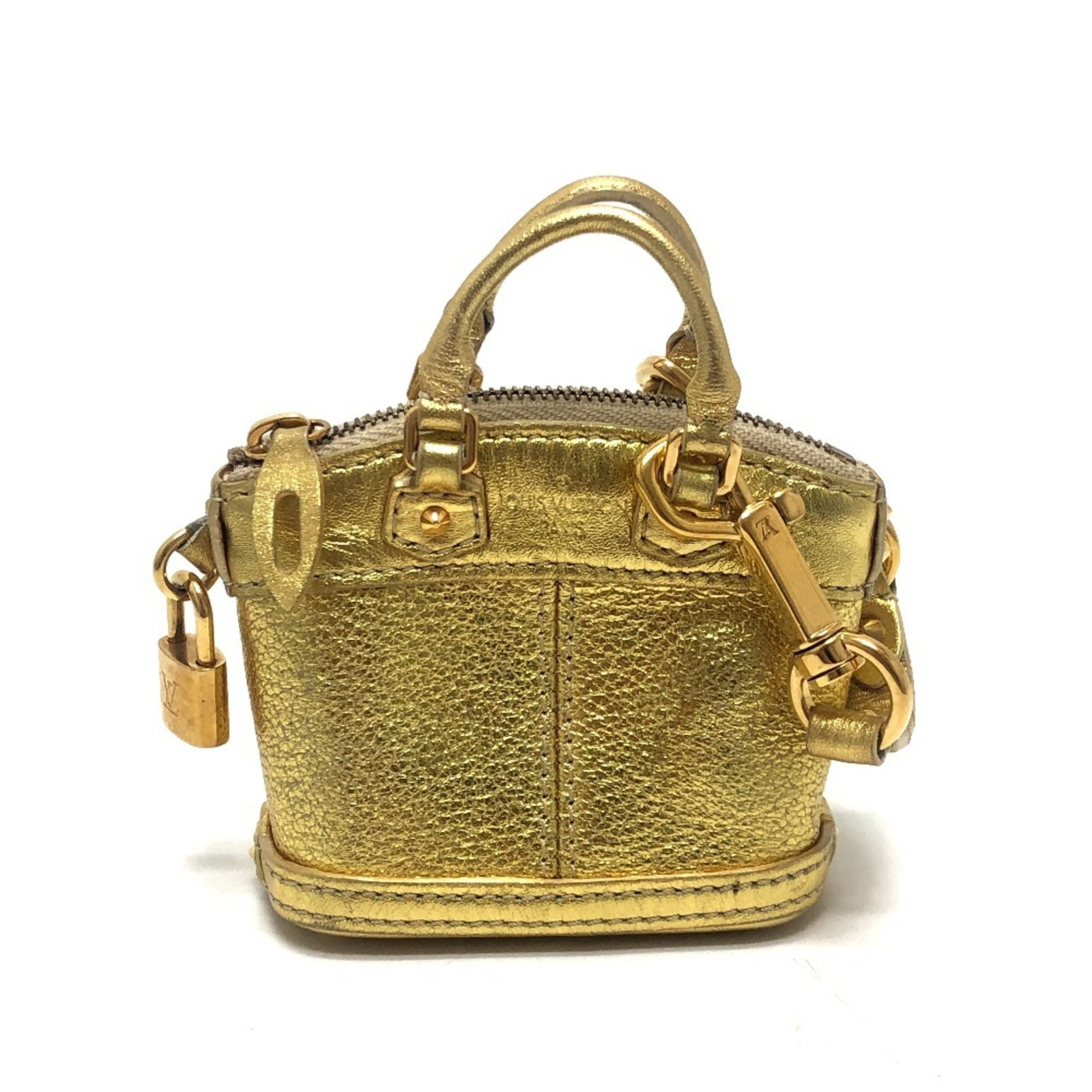 Handbag Suhali Leather Louis Vuitton: Handbag Suhali Leather Louis Vuitton Suhali leather Louis Vuitton handbag from France, featuring a gold color and compact size of 7cm x 9cm x 4.5cm. This stylish pouch is crafted from high-quality Suh