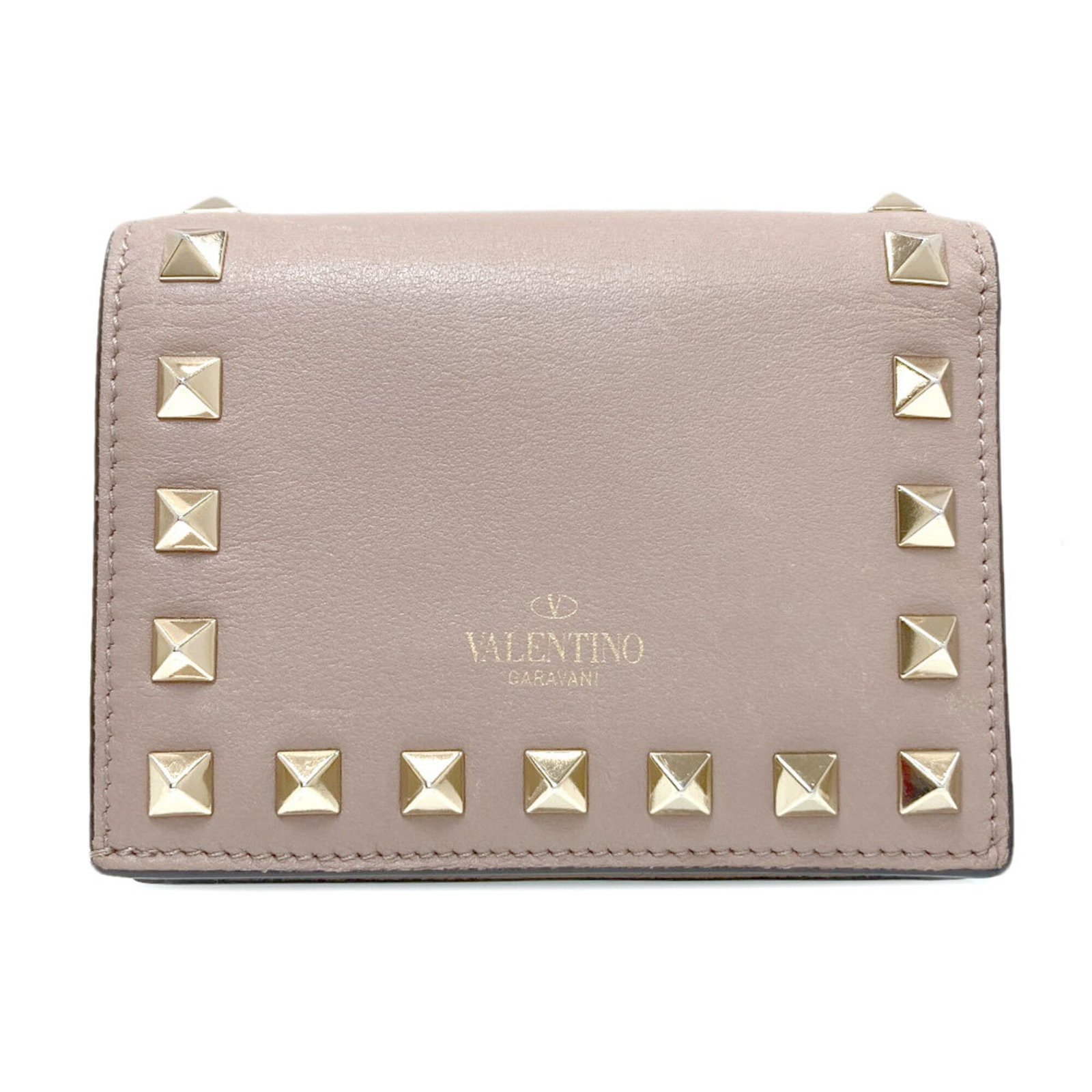 Valentino Wallet (Bi-Fold) Leather: Valentino Wallet (Bi-Fold) Leather Valentino's bi-fold leather wallet boasts a classic design with clean lines and a timeless aesthetic. Made from high-quality beige leather, this wallet measures