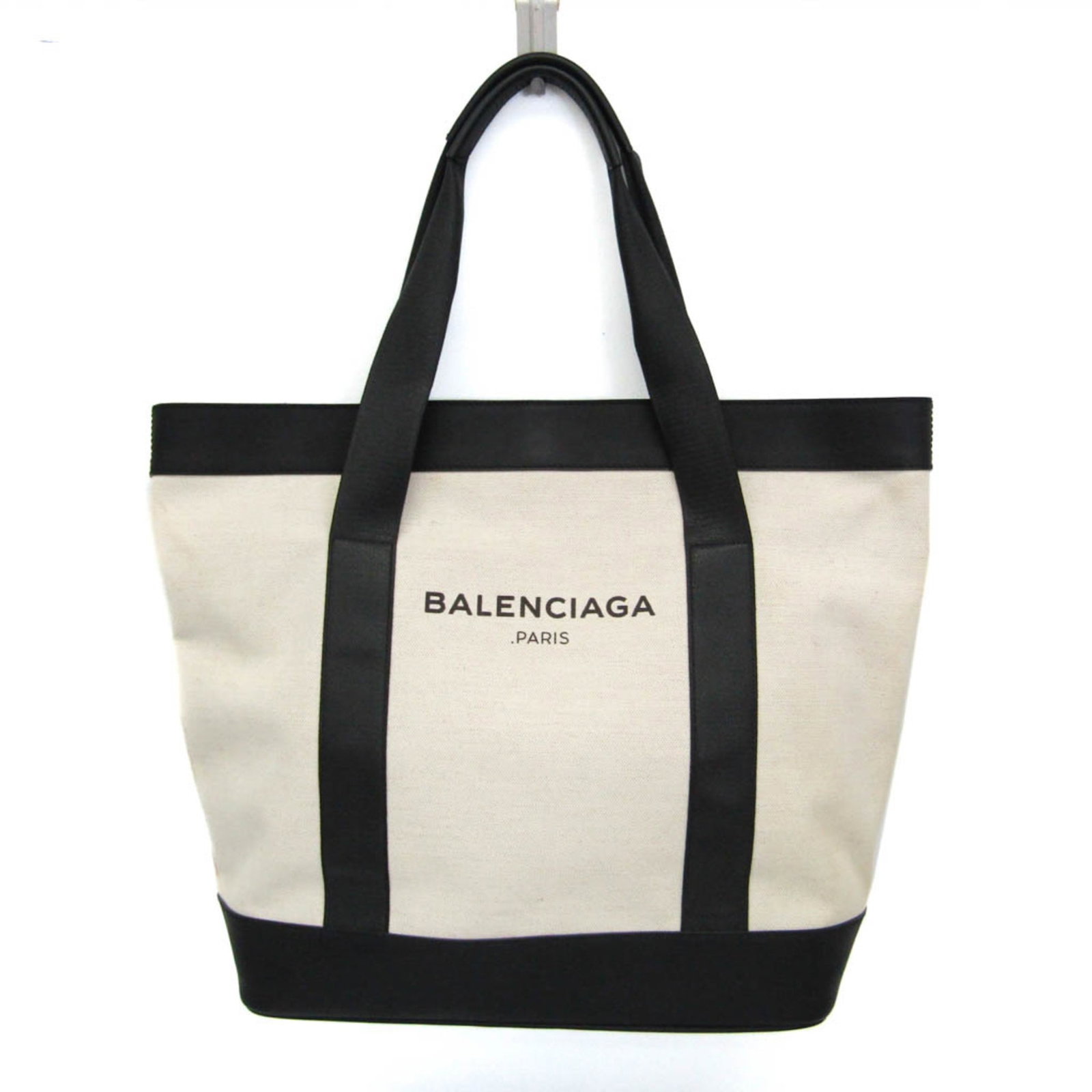 Tote Bag Canvas Leather Balenciaga: Tote Bag Canvas Leather Balenciaga Canvas and leather combine in this Balenciaga Navy Tote bag, featuring a 48cm opening width and a snap closure. The bag includes a zipper pocket and an open pocket,