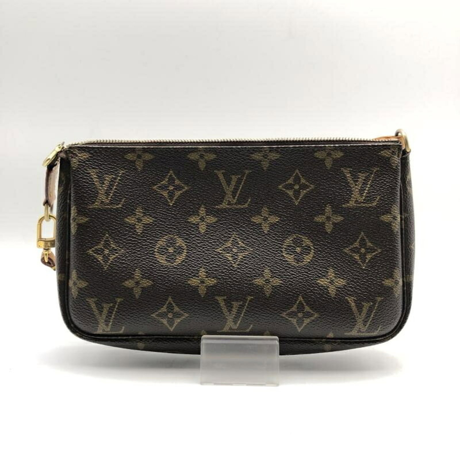 Louis Vuitton Handbag Pochette: Louis Vuitton Handbag Pochette Brown Louis Vuitton Pochette Handbag. 11cm x 21cm x 3cm in size, this pochette features the iconic Louis Vuitton design. Made from high-quality materials, its classic