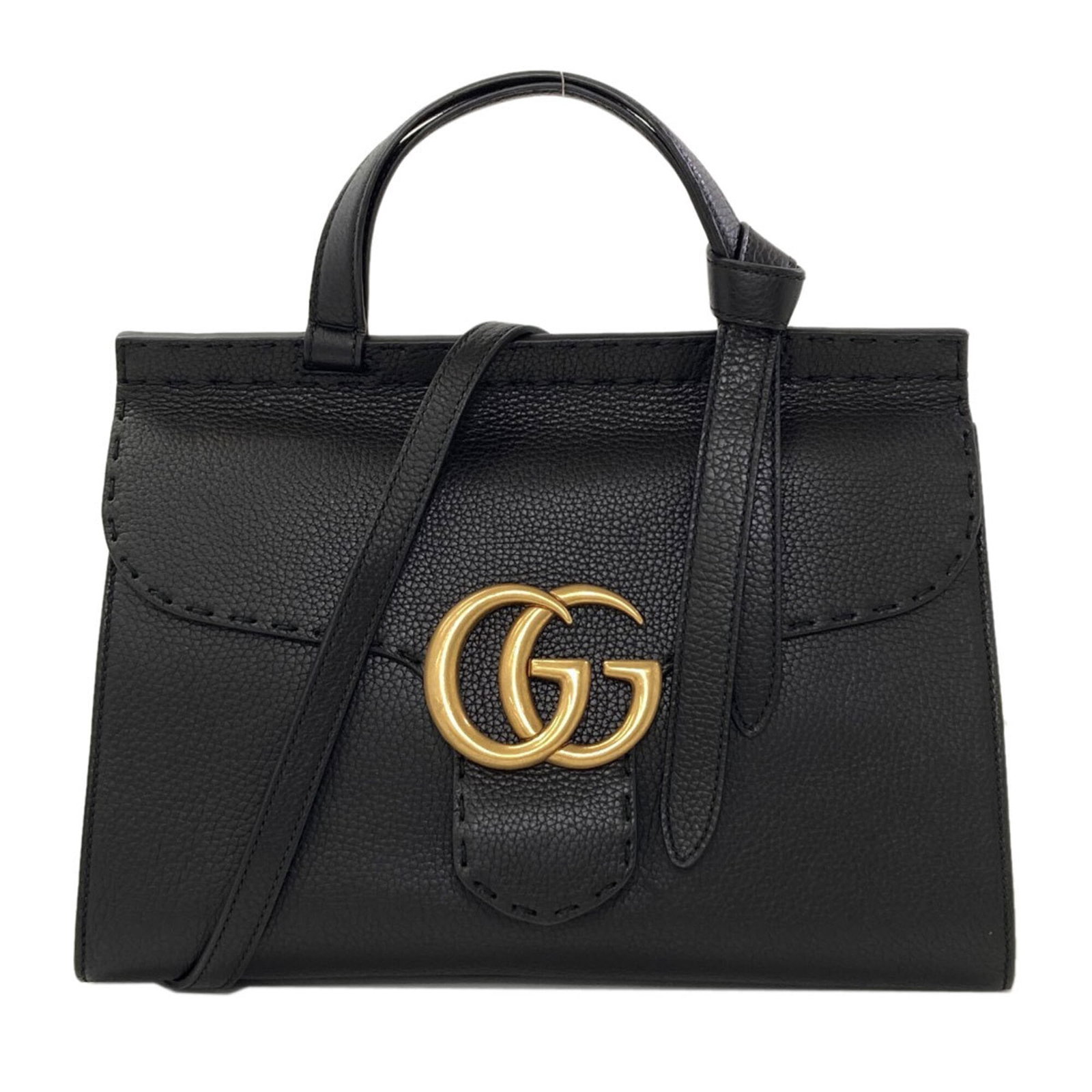 Handbag Leather Gucci: Handbag Leather Gucci Black GG Marmont Leather Gucci Handbag. This sleek and sophisticated handbag features a signature GG Marmont design, made from high-quality black leather. With its spacious inter