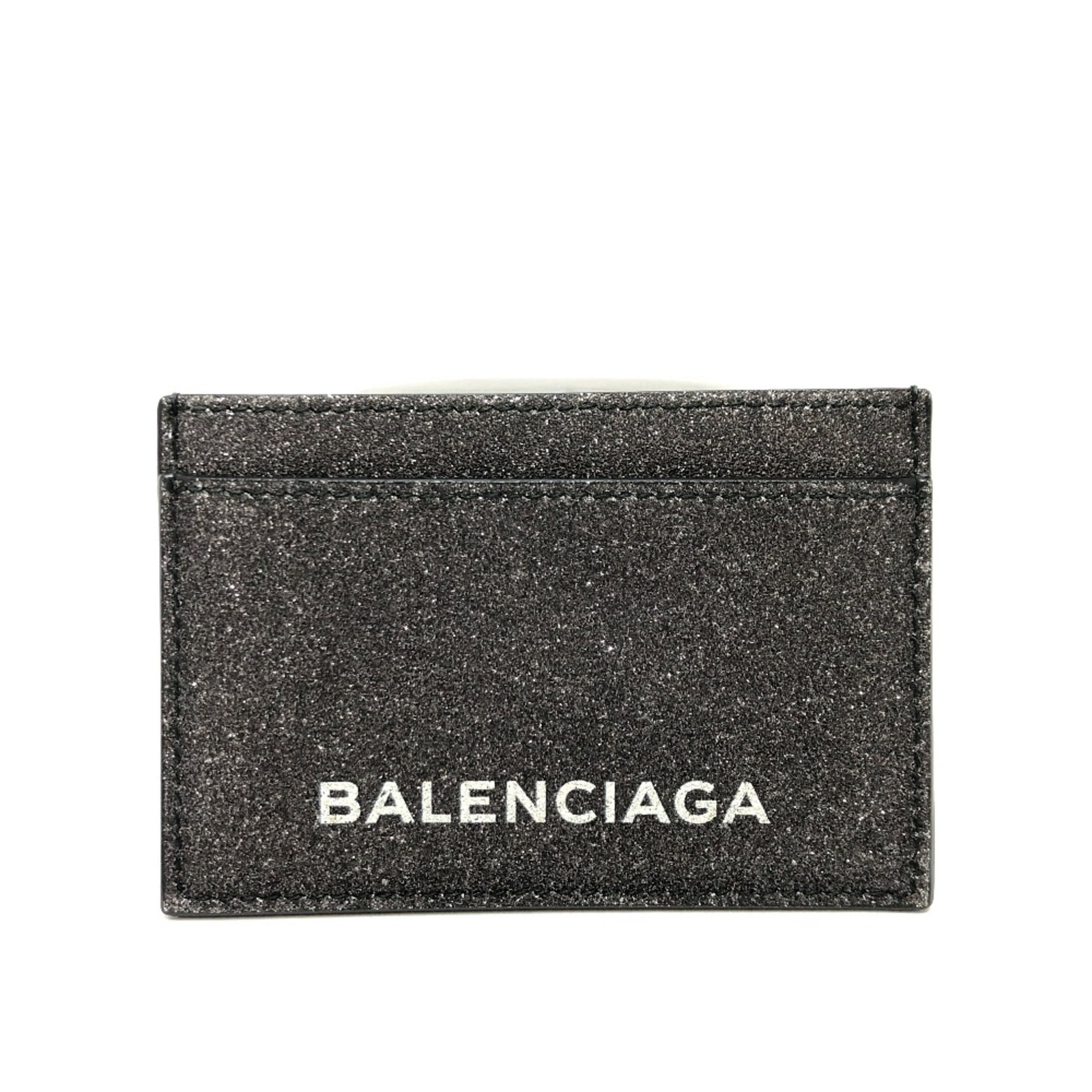 Card case Leather Balenciaga: Card case Leather Balenciaga This Balenciaga card case is crafted from high-quality leather, available in a sleek gray color. Measuring 10.5cm x 7cm, it features a compact design with a subtle