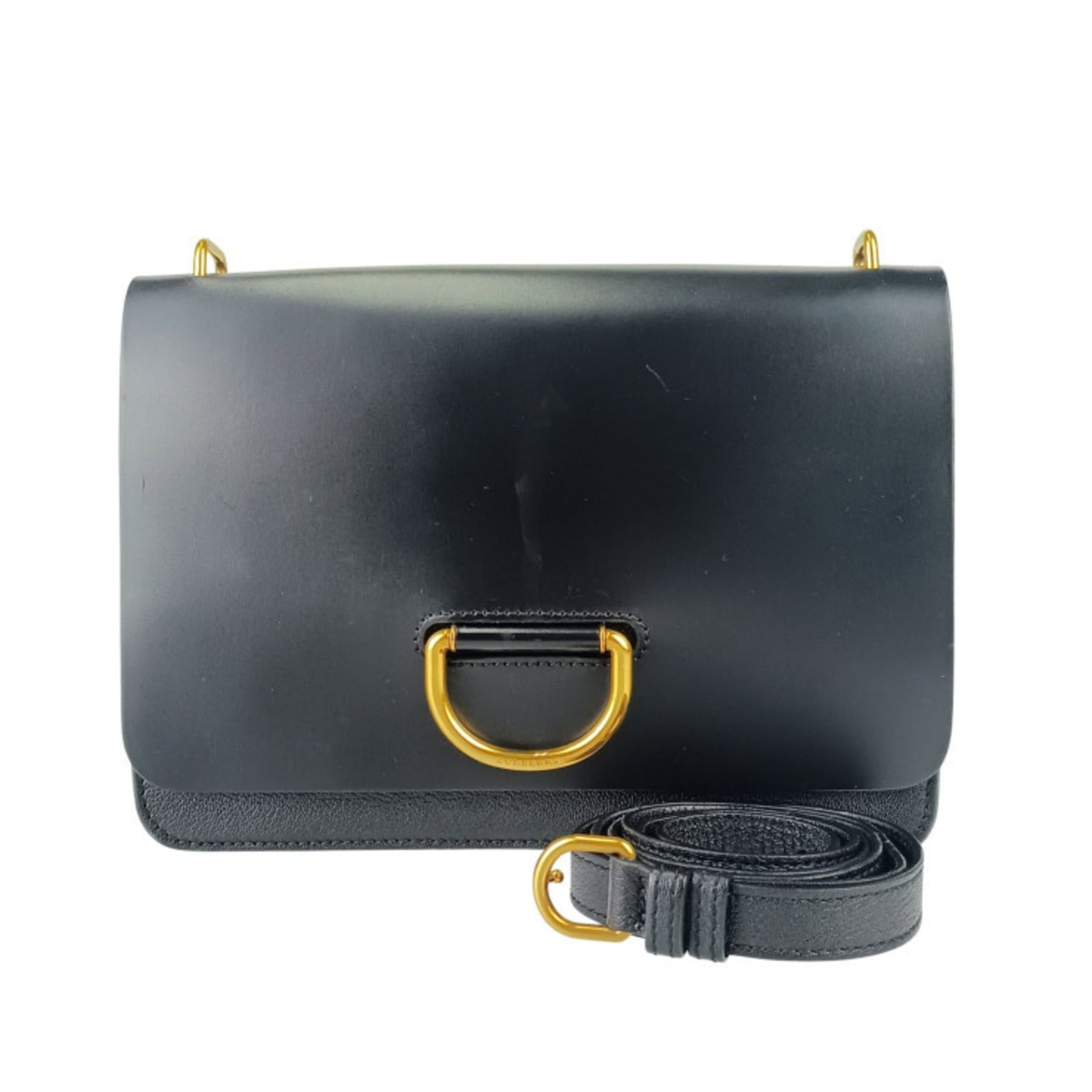 Burberry Handbag Shoulder Bag Leather: Burberry Handbag Shoulder Bag Leather Black leather shoulder bag with a flap closure from Burberry, featuring a zipper pocket and open pocket for storage. Made from high-quality leather, this bag