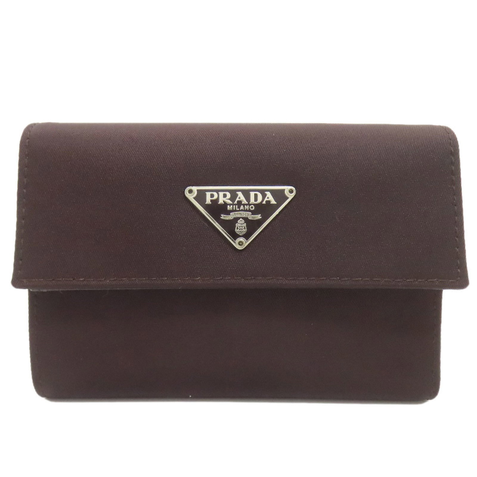 Nylon Prada Wallet Bi Fold: Nylon Prada Wallet Bi Fold Dark brown nylon bi-fold wallet from Prada, measuring 8cm x 12cm x 2cm. This compact wallet features a durable nylon material and a classic bi-fold design. Item Specifics: